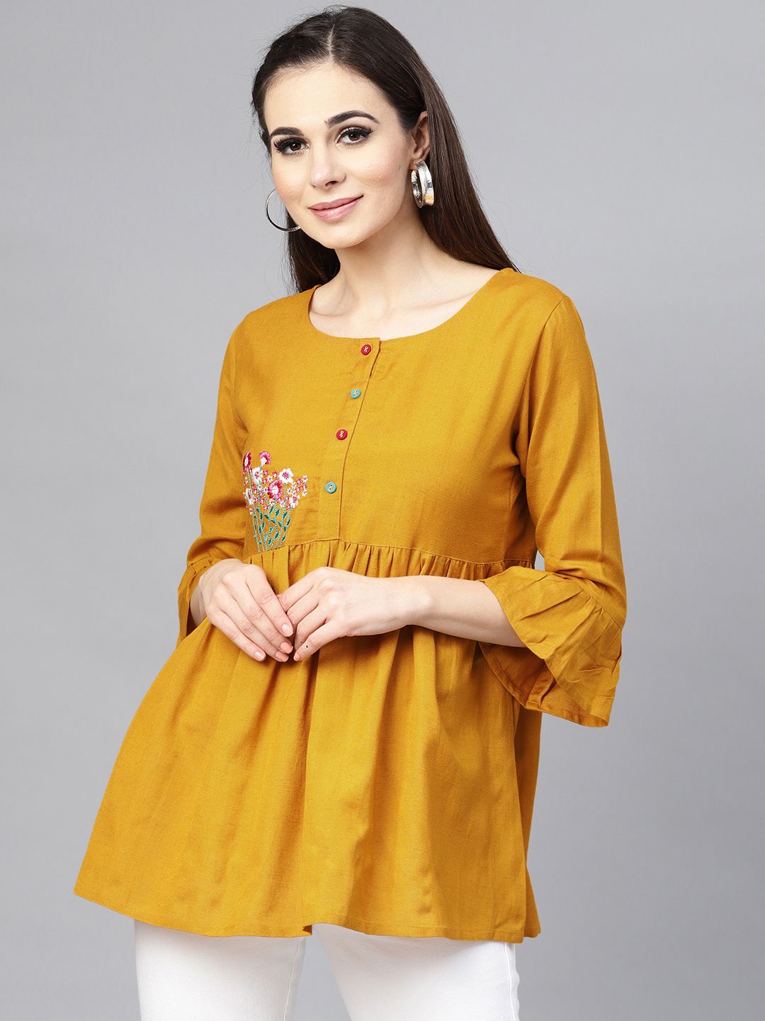 Varanga mustard floral embroidered tunic with white elasticated dhoti pants Price in India