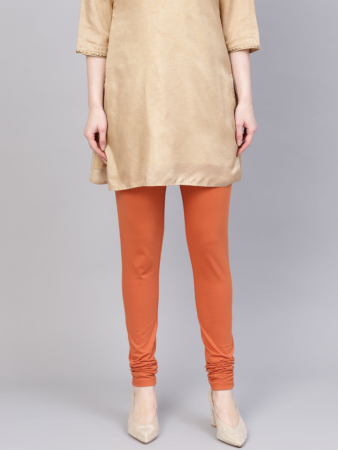 W Women Rust Orange Solid Churidar Length Leggings Price in India