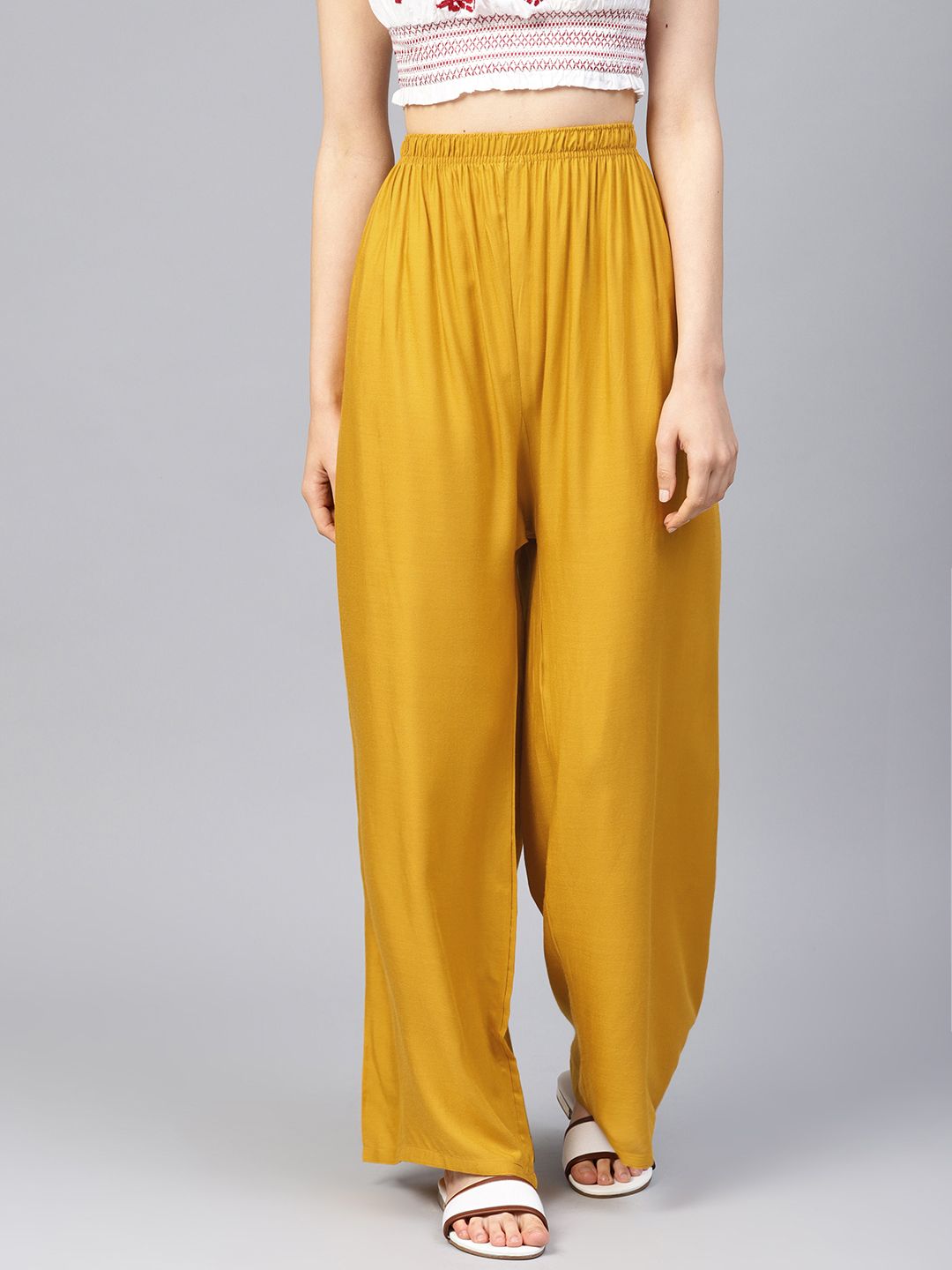 Jompers Women Mustard Yellow Solid Wide Leg Palazzos Price in India