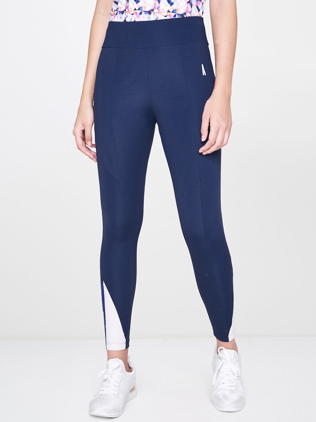 AND Women Navy Blue Solid Activewear Tights Price in India