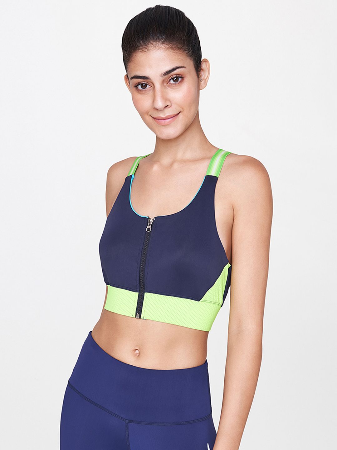 AND Blue Colourblocked Non-Wired Lightly Padded Activewear Sports Bra Price in India