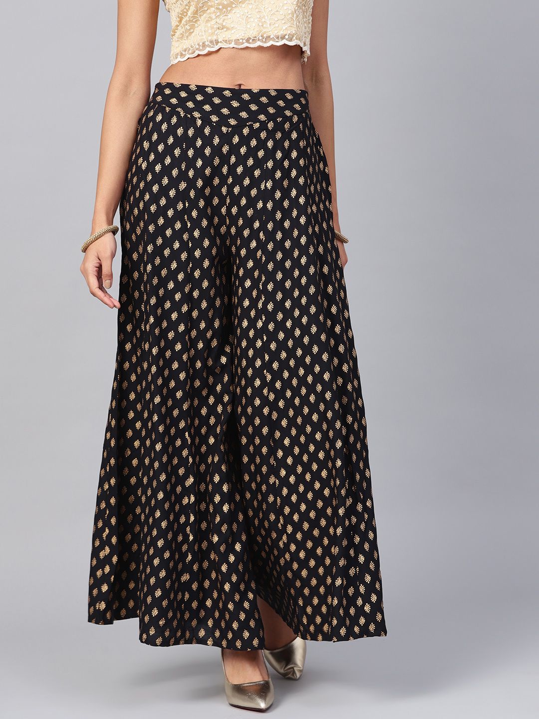 Juniper Women Black & Gold-Toned Printed Flared Palazzos Price in India