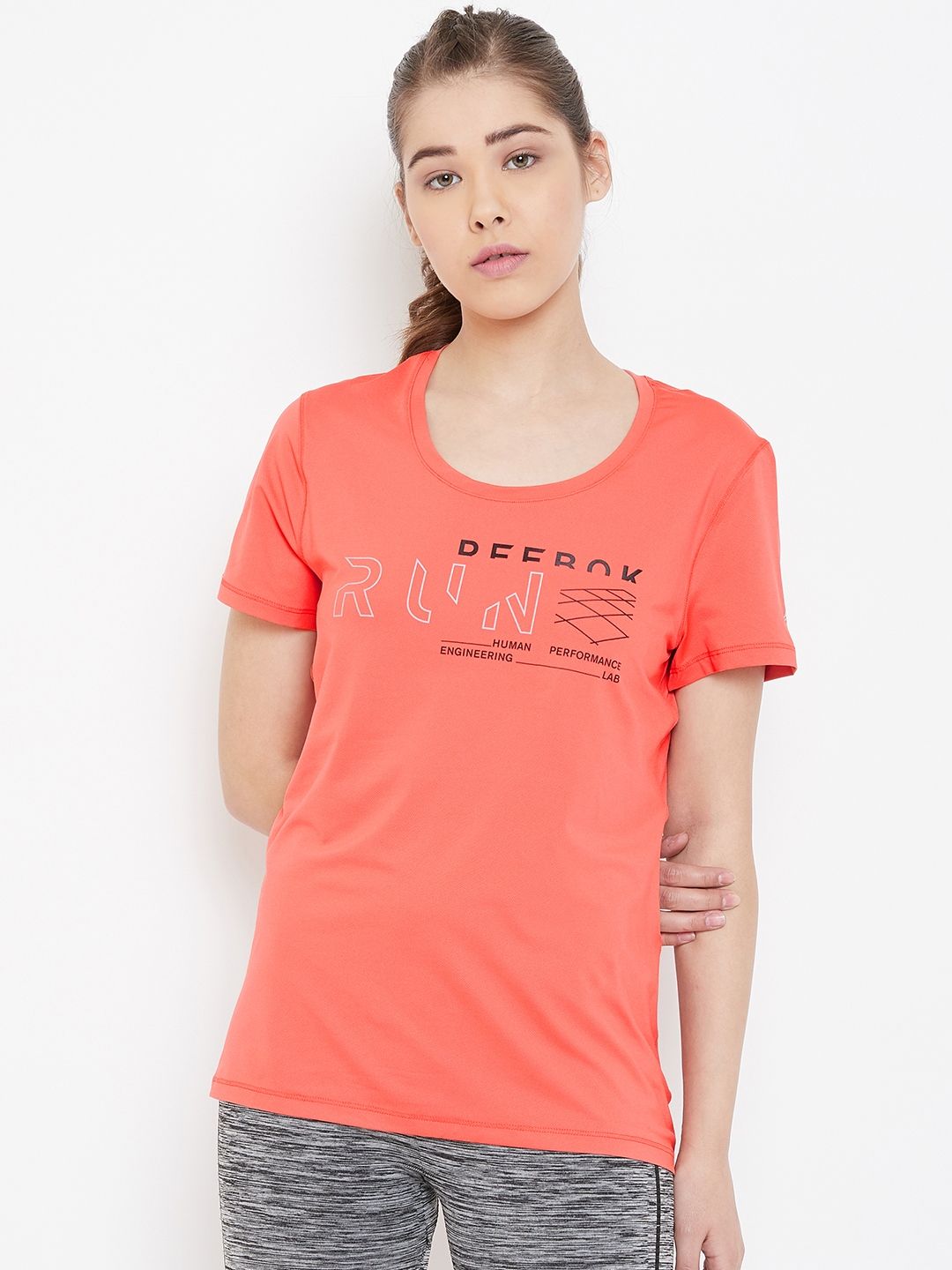 Reebok Women Coral Orange Printed OSR Micro Mesh Running T-shirt Price in India