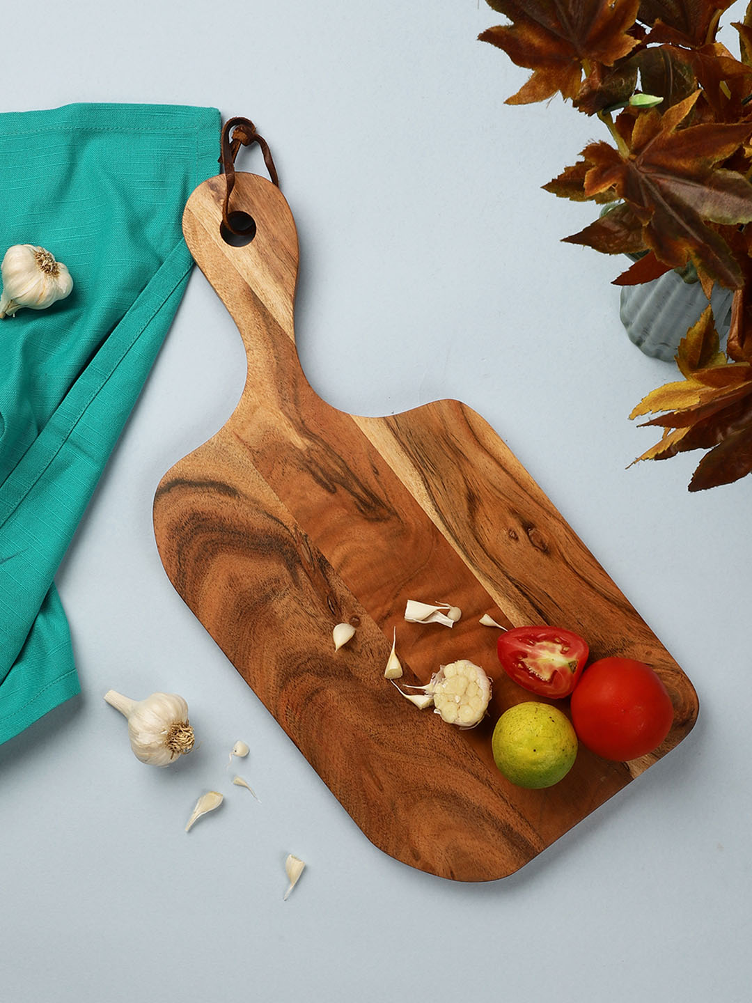 VarEesha Brown Solid Bottle Shaped Chopping Board Price in India
