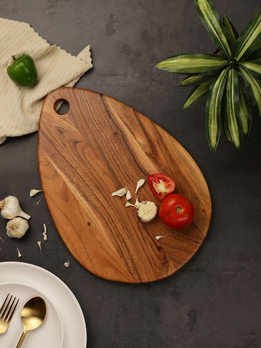 VarEesha Brown Solid Drop Shaped Chopping Board Price in India