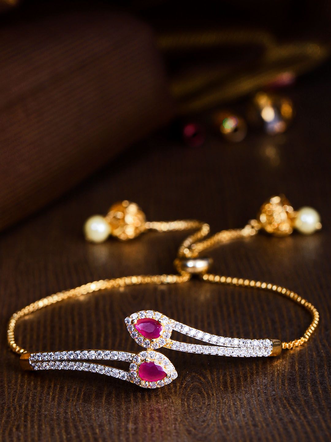 Priyaasi Magenta Gold-Plated CZ Stone-Studded Handcrafted Chain Bracelet Price in India