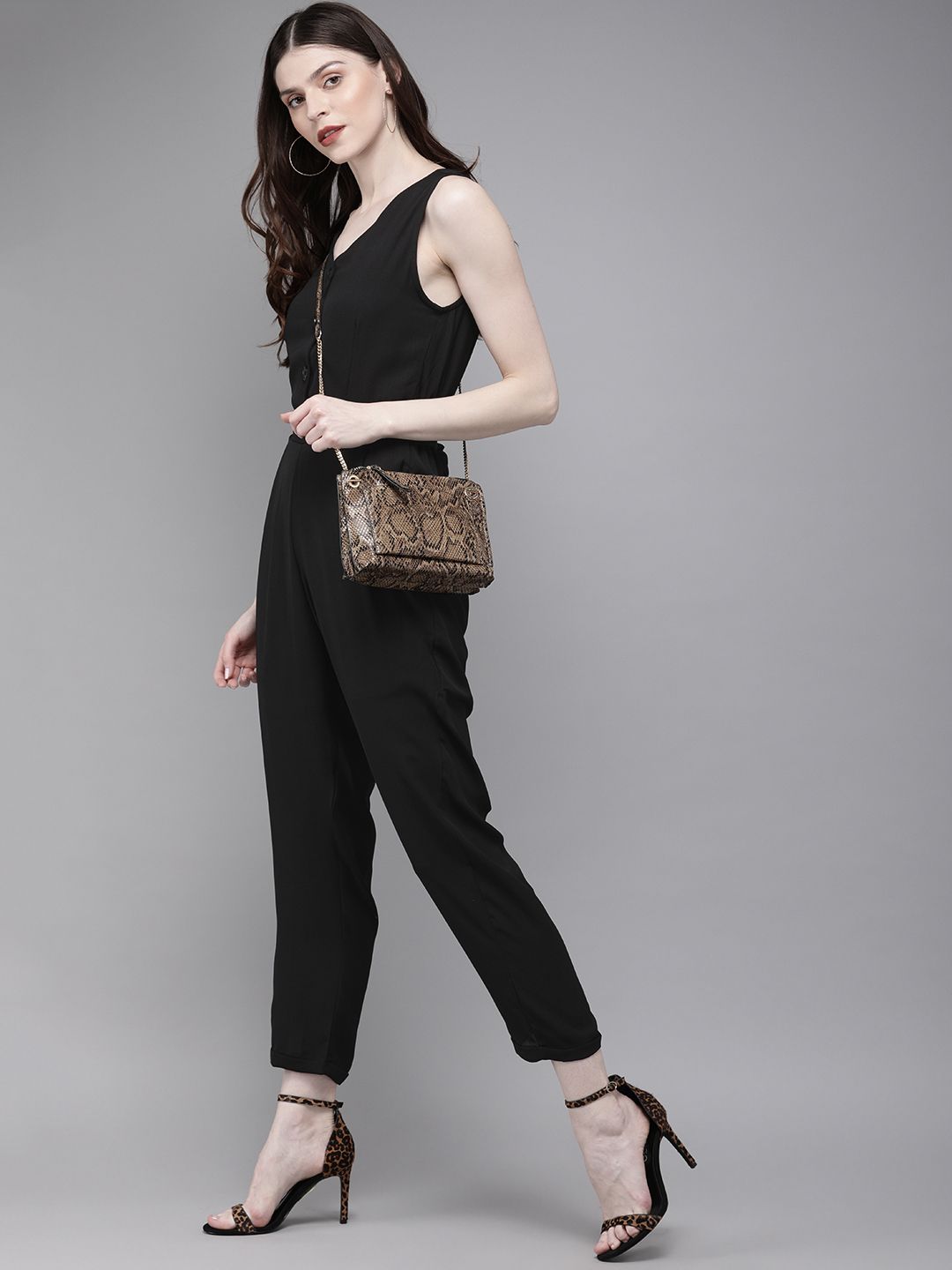 SASSAFRAS Women Black Solid Tapered Fit Basic Jumpsuit With Tie-Up Detailing Price in India