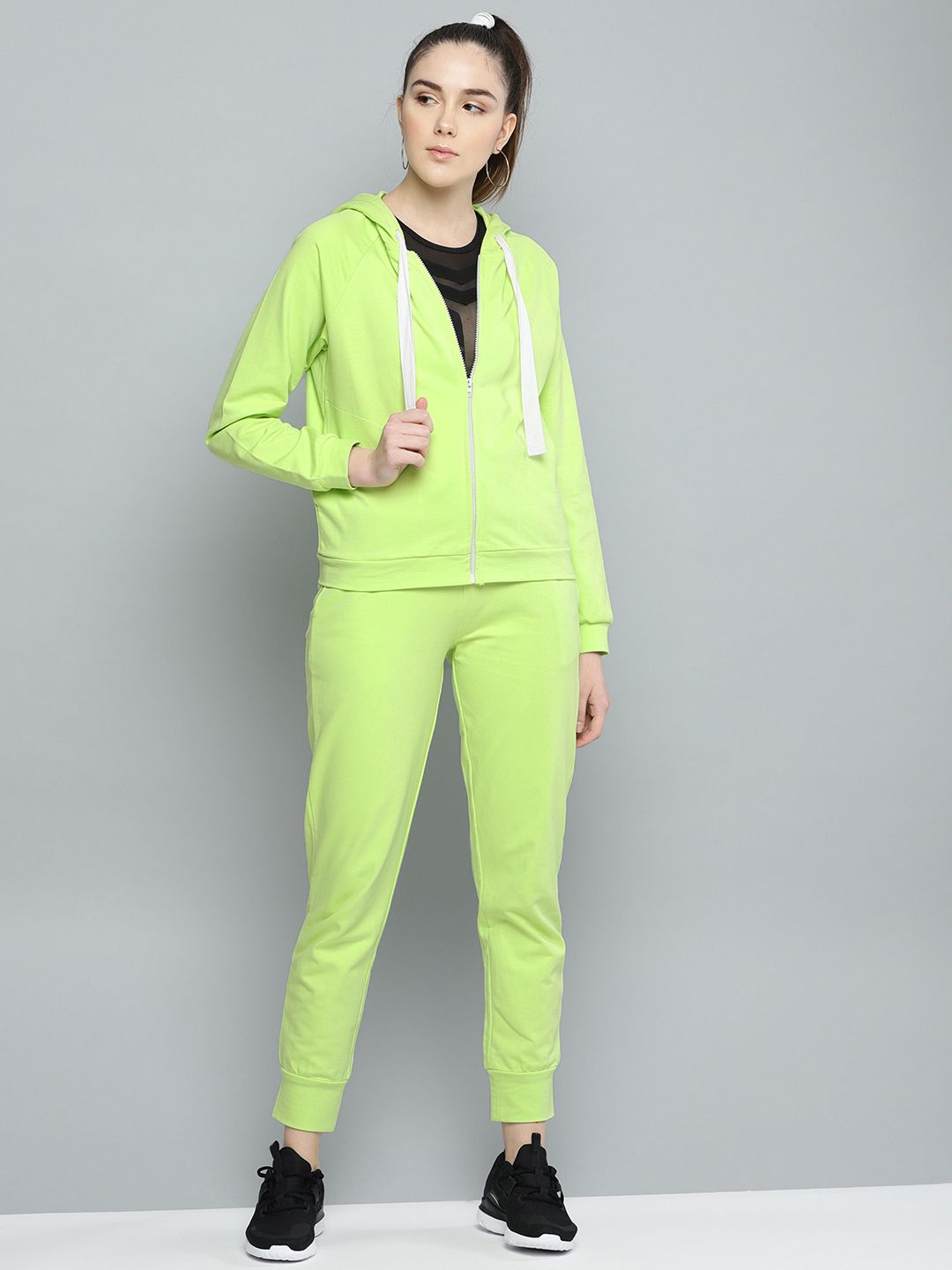Besiva Women Fluoroscent Green Solid Track Suit Price in India
