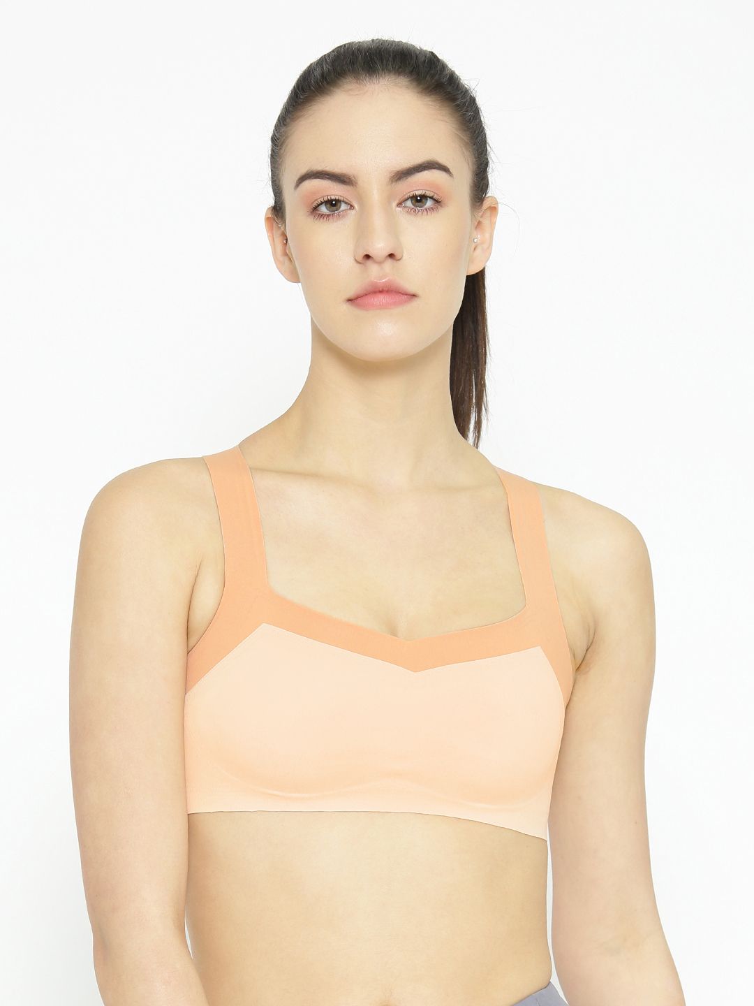 EROTISSCH Peach-Coloured Solid Non-Wired Lightly Padded Sports Bra AIB-16A Price in India