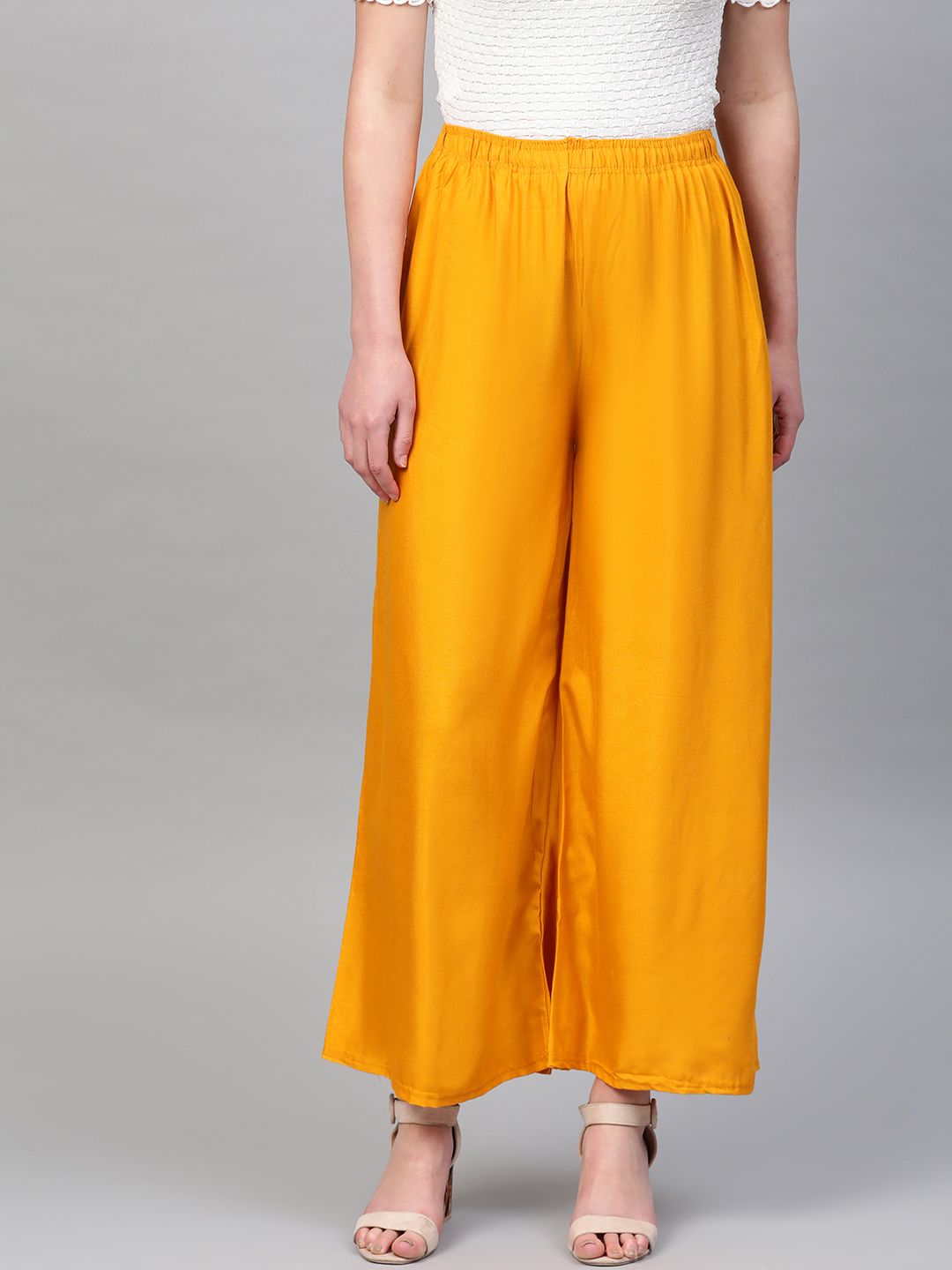 PINKSKY Women Mustard Yellow Solid Straight Palazzos Price in India