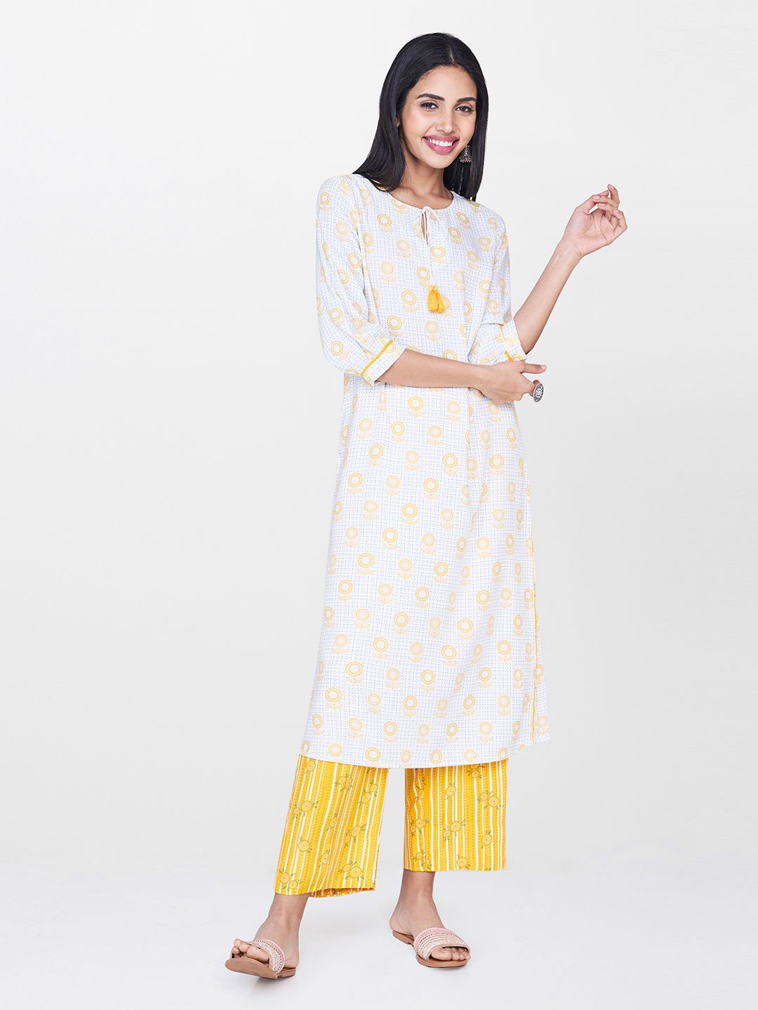 Global Desi Women Off-White & Yellow Printed A-Line Kurta Price in India
