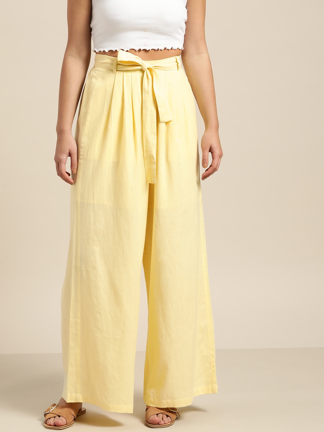 Shae by SASSAFRAS Women Yellow Regular Fit Solid Palazzos Price in India