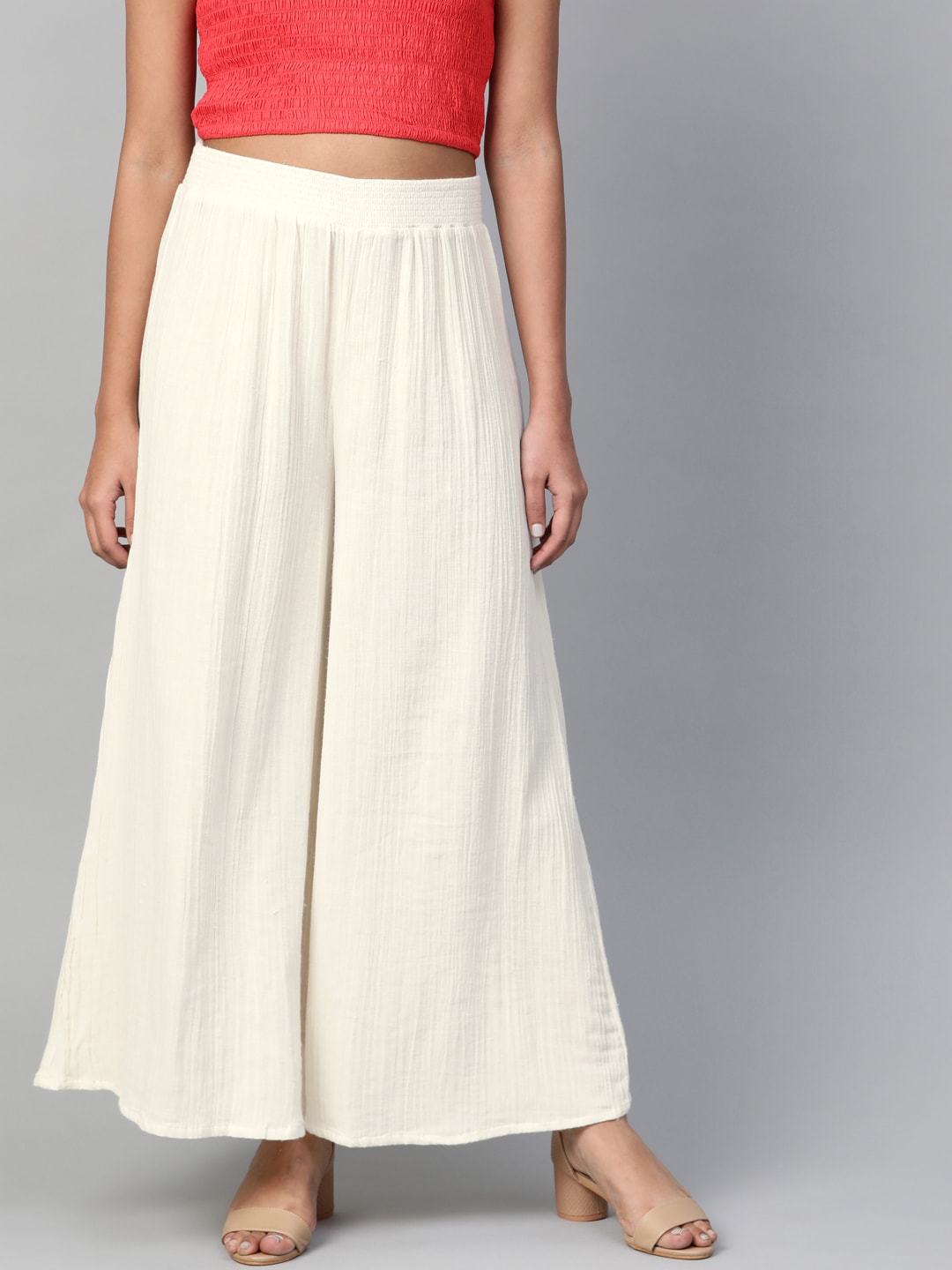 W Women Off-White Solid Flared Palazzos Price in India