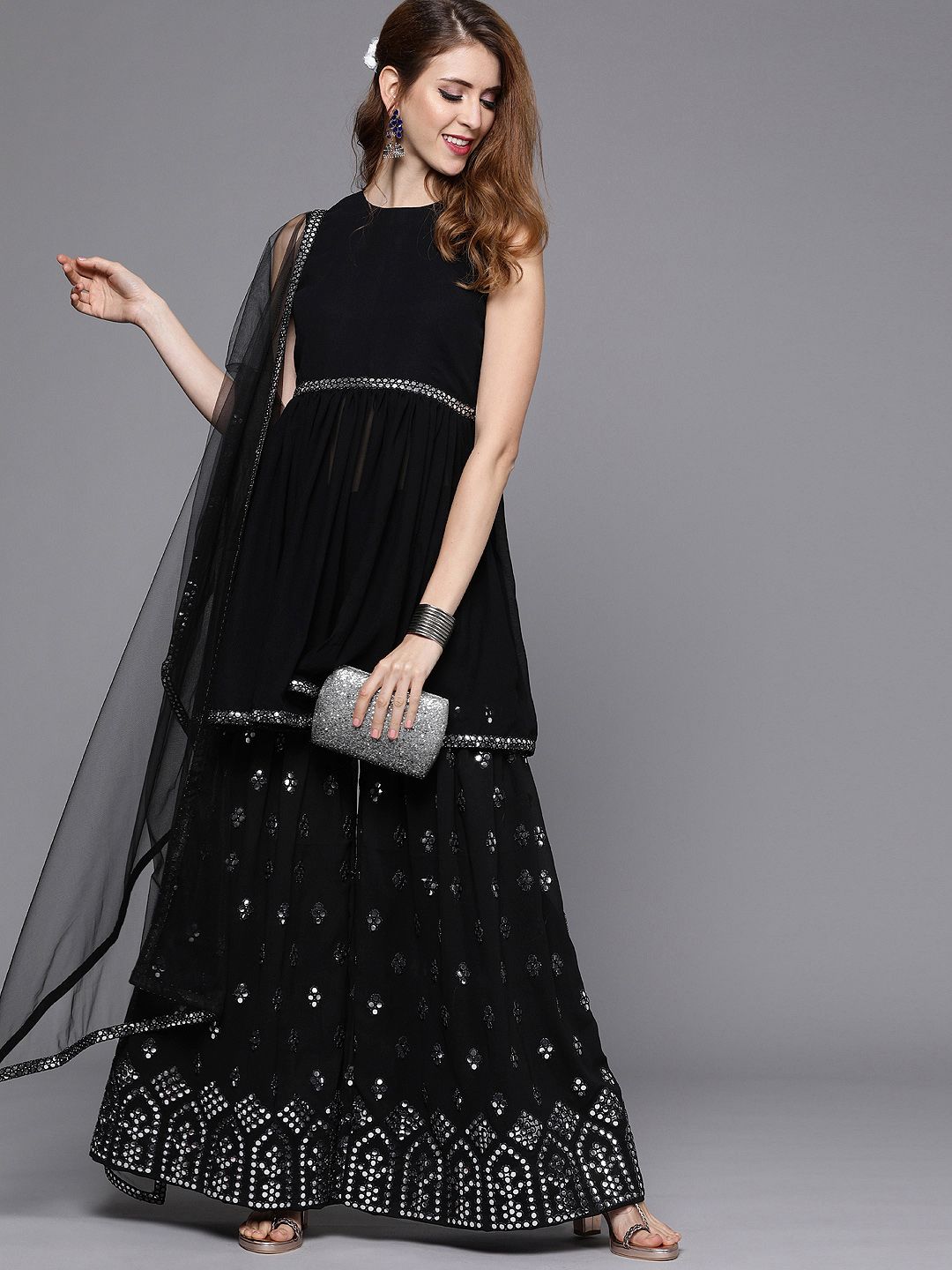 Inddus Women Black Solid Georgette Kurta with Sharara & Dupatta WIth Foil Print