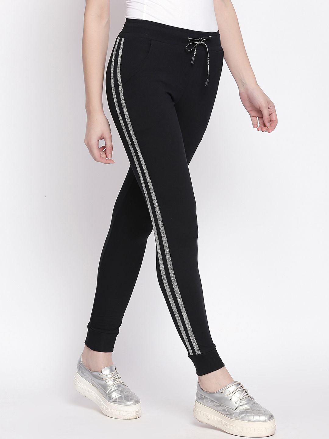 I like me Women Black Solid Strip Joggers Price in India