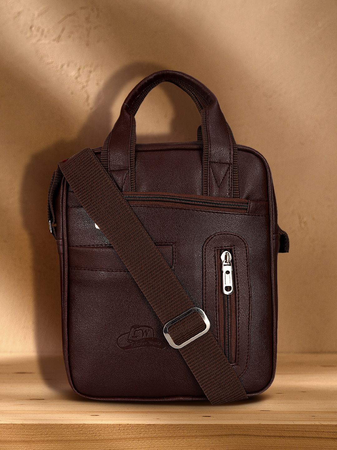 Leather World Brown Solid Handheld Bag Price in India