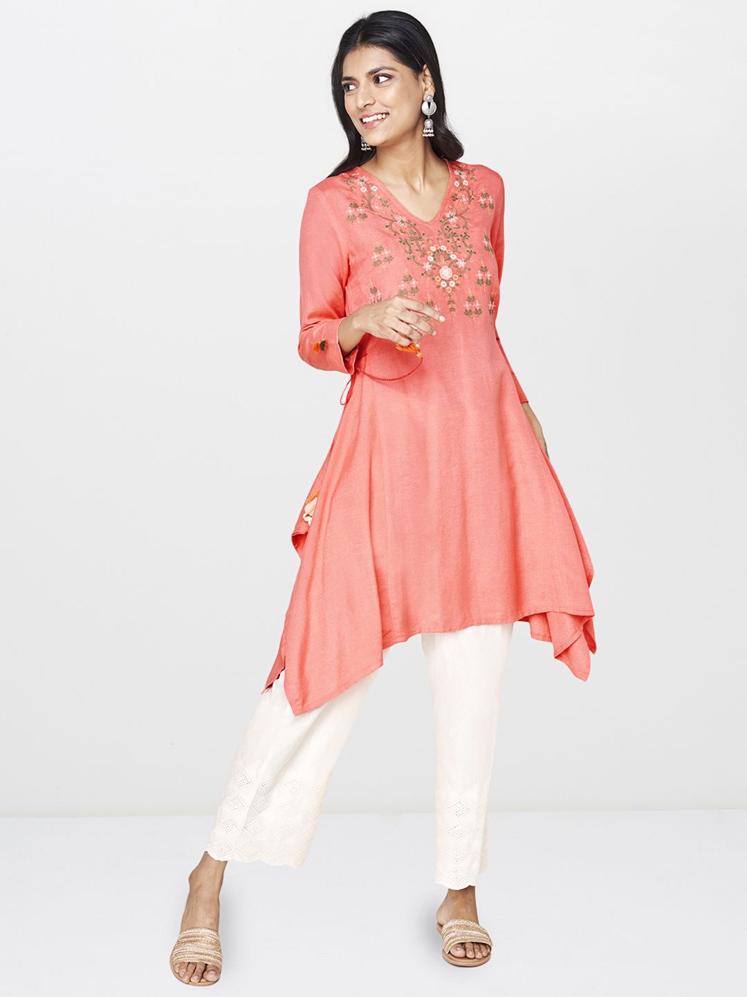Global Desi Women Coral Pink Embroidered Tunic With Asymmetric Hem & Waist Tie Up Price in India