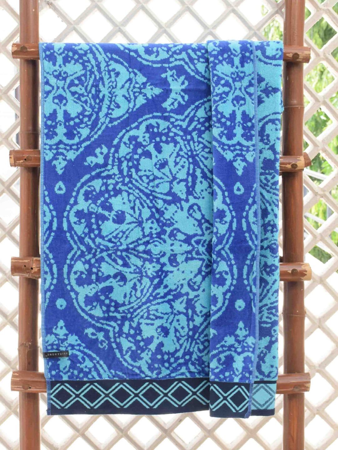 Avira Home Unisex Blue Printed Mayhem Pool Velour Finish 380GSM Bath Towel Price in India