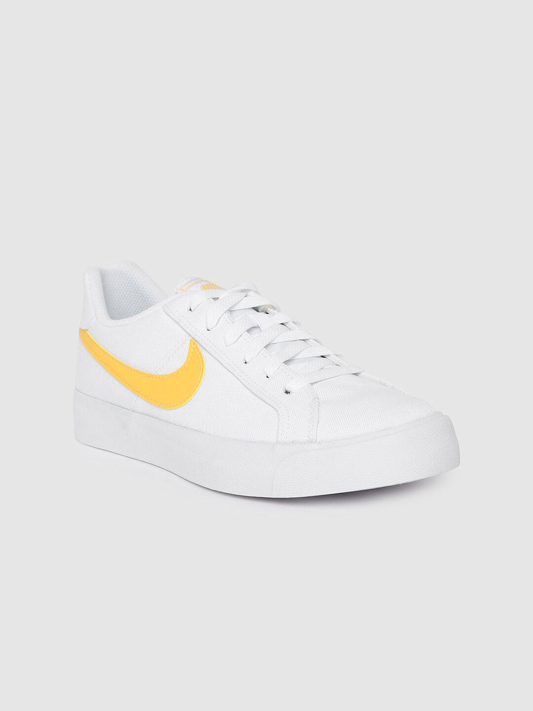 nike women white solid sneakers