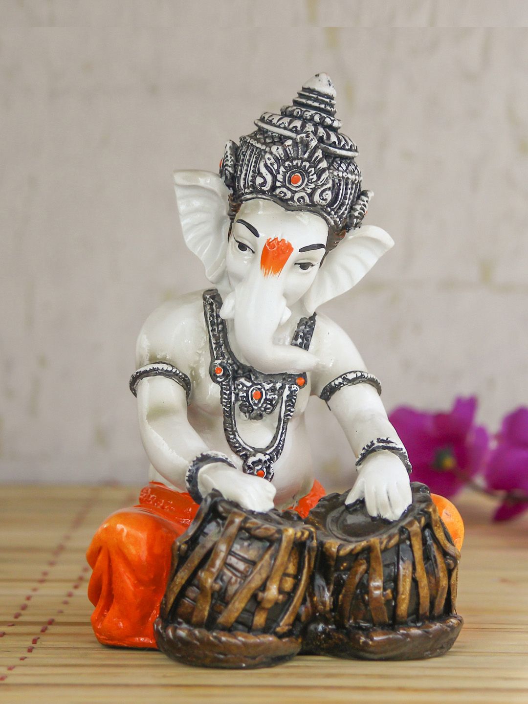 eCraftIndia Off-White & Orange Handcrafted Lord Ganesha Playing Tabla Idol Showpiece Price in India