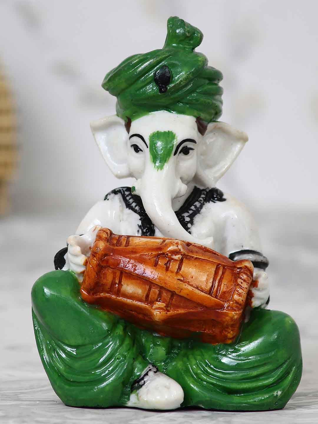 eCraftIndia Off-White & Green Handcrafted Lord Ganesha Playing Dholak Idol Price in India