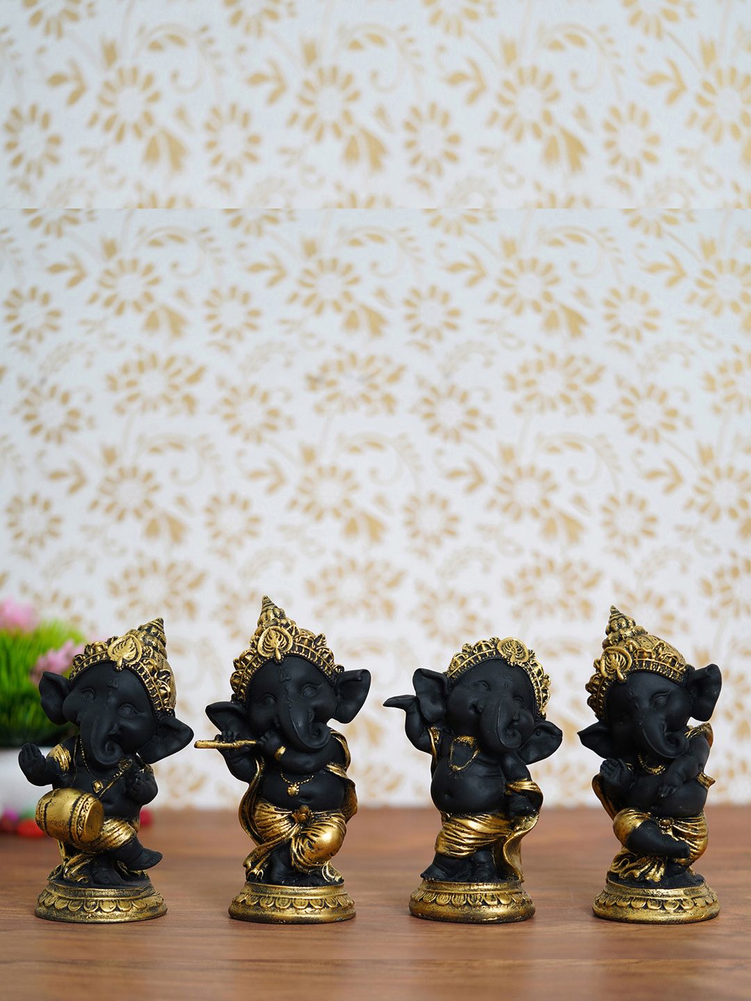 eCraftIndia Set of 4 Black & Gold-Toned Lord Ganesha Dancing Avatar Idols Price in India