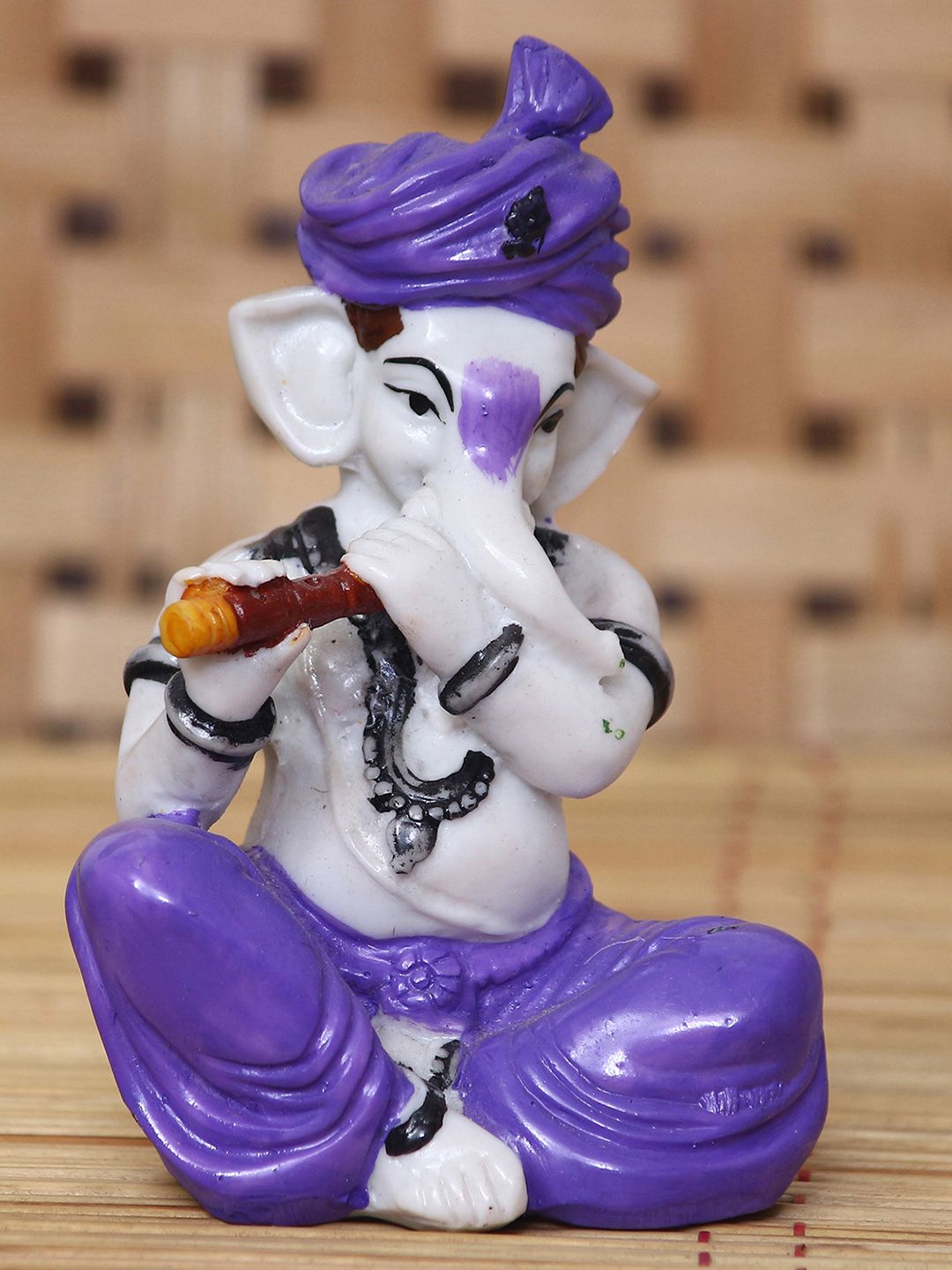 eCraftIndia White & Purple Handcrafted Lord Ganesha Playing Flute Showpiece Price in India