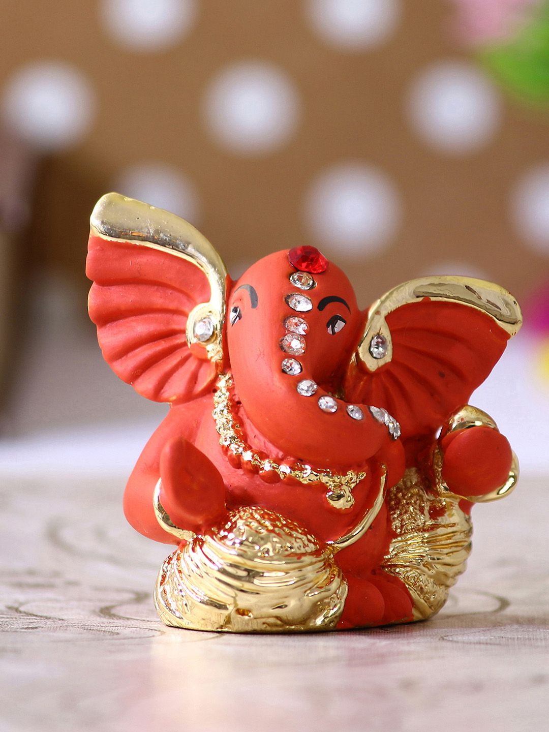 eCraftIndia Orange & Gold-Toned Handcrafted Mini Kaan Ganesha Decorative Showpiece Price in India