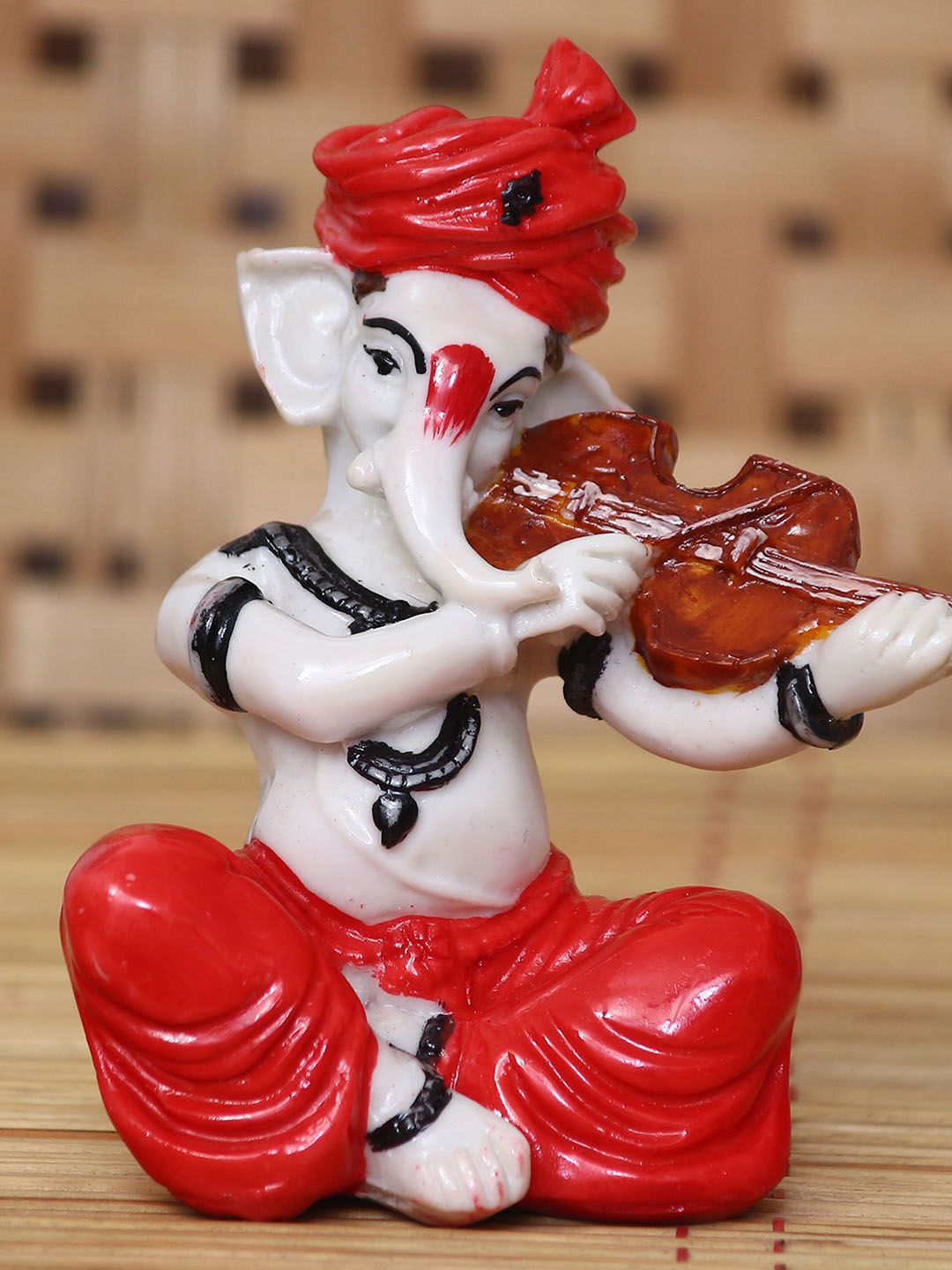 eCraftIndia White & Red Handcrafted Lord Ganesha Playing Violin Showpiece Price in India