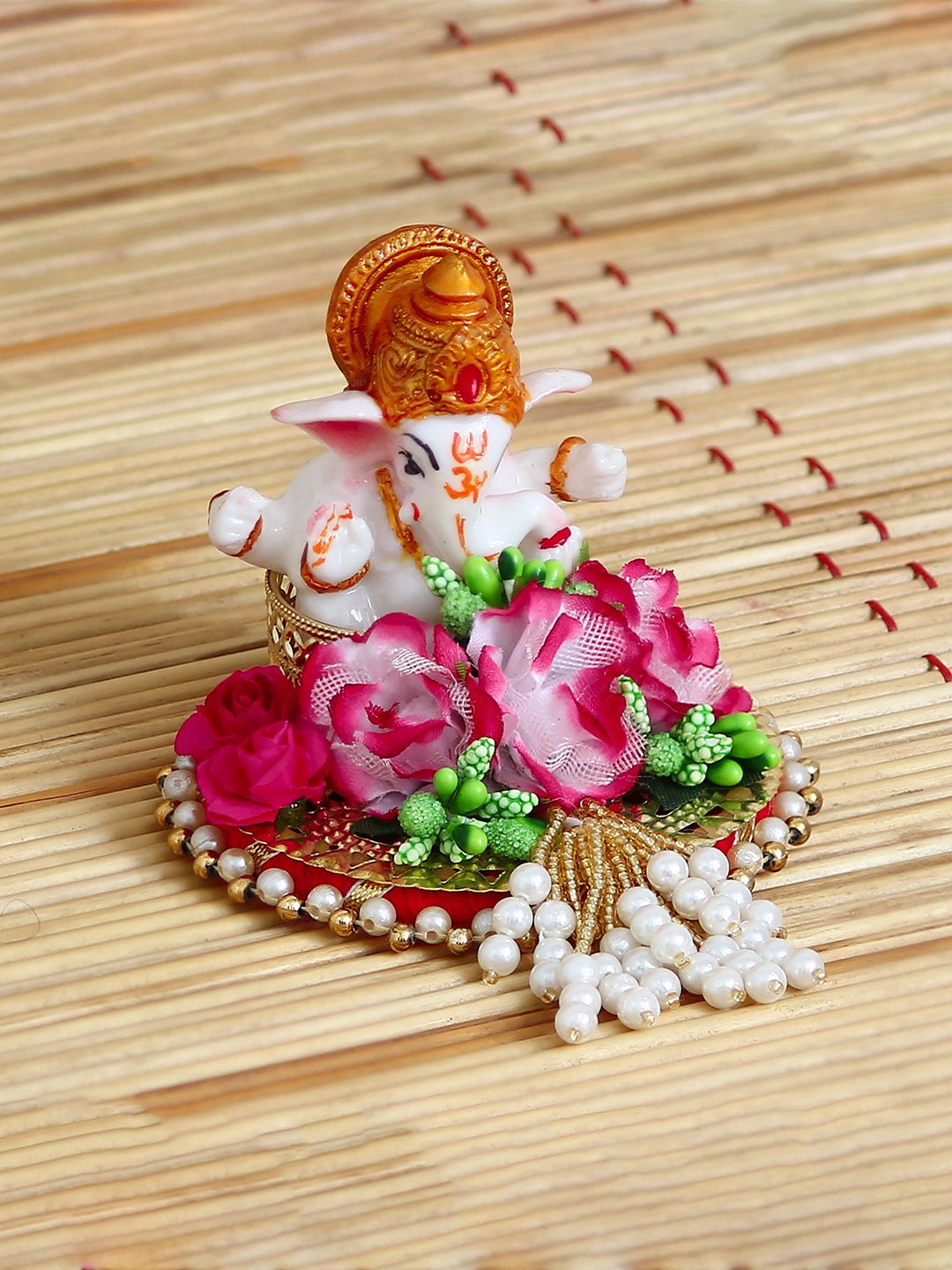 eCraftIndia White & Pink Handcrafted Lord Ganesha On Decorative Plate With Flowers Showpiece Price in India