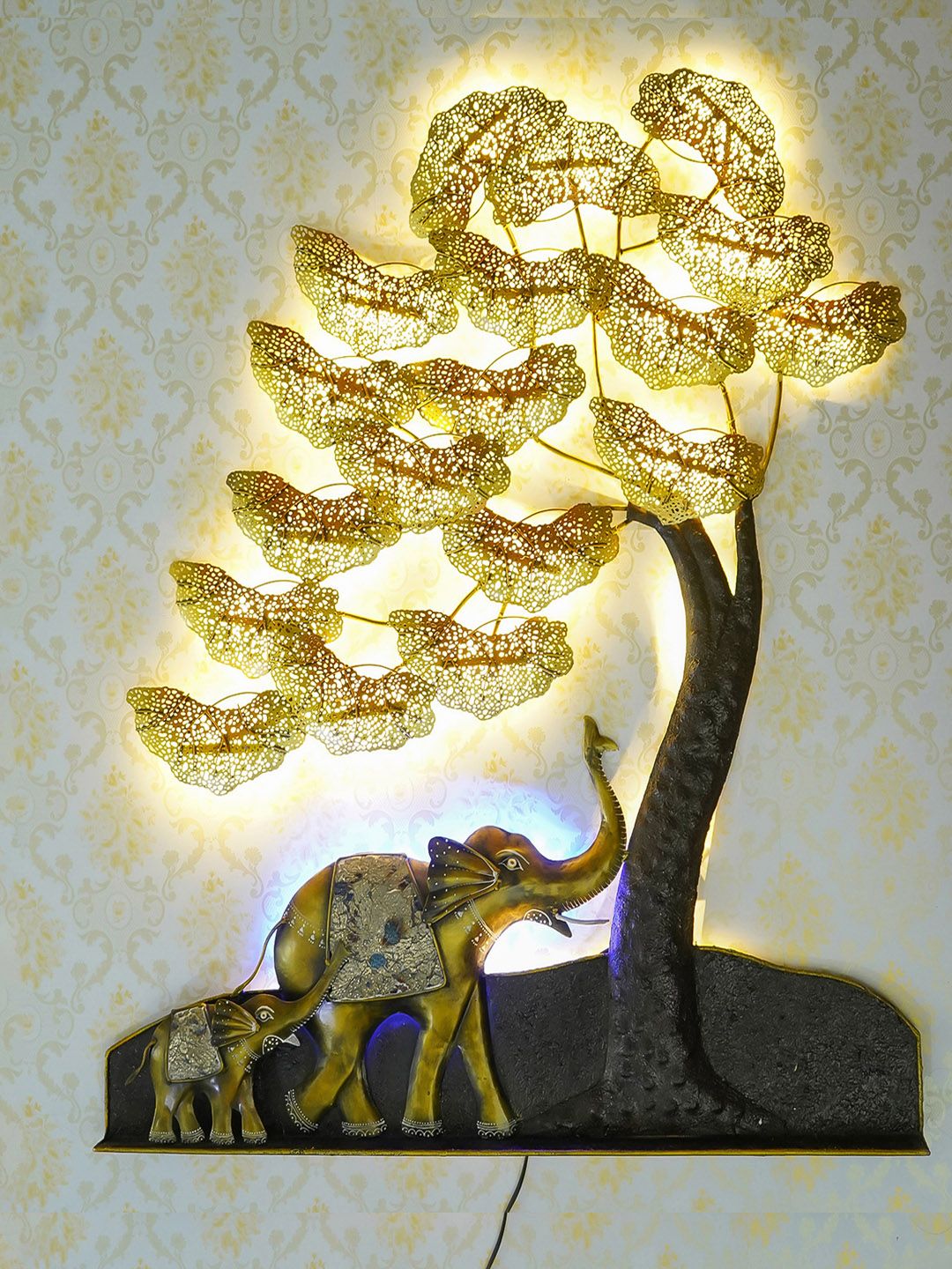 eCraftIndia Gold-Toned & Black Handcrafted Elephant Family Under Golden Leaves Tree Wall Hanging with Background LED's Price in India