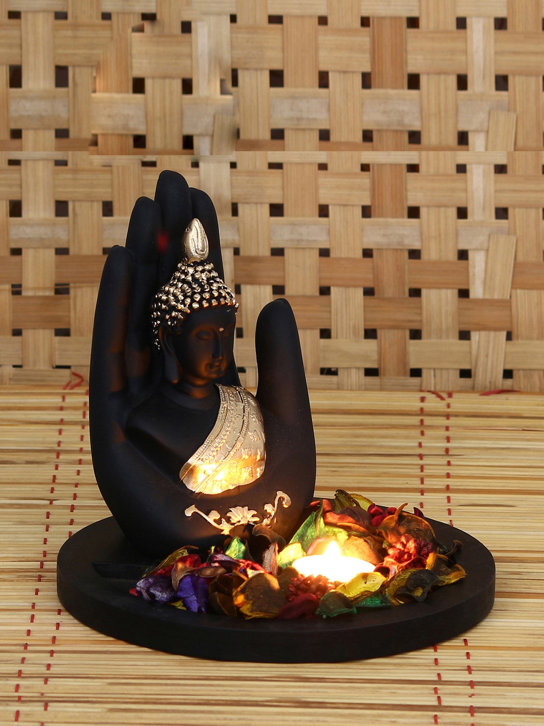 eCraftIndia Black & Gold-Toned Handcrafted Palm Buddha Showpiece With Fragrant Petals and Tealight Price in India