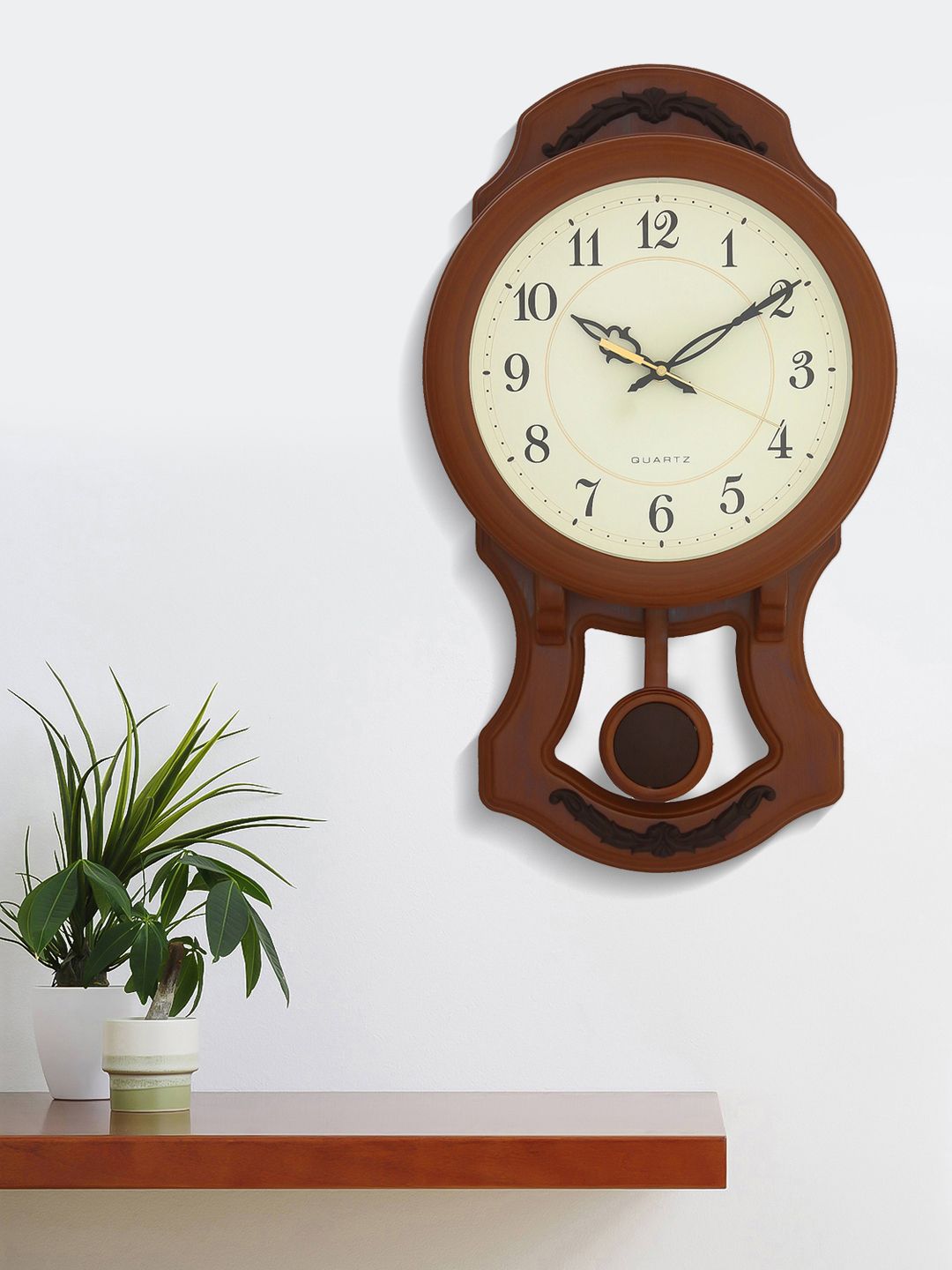 eCraftIndia Brown Abstract Shaped Solid Analogue Wall Clock 26 cm x 46 cm Price in India