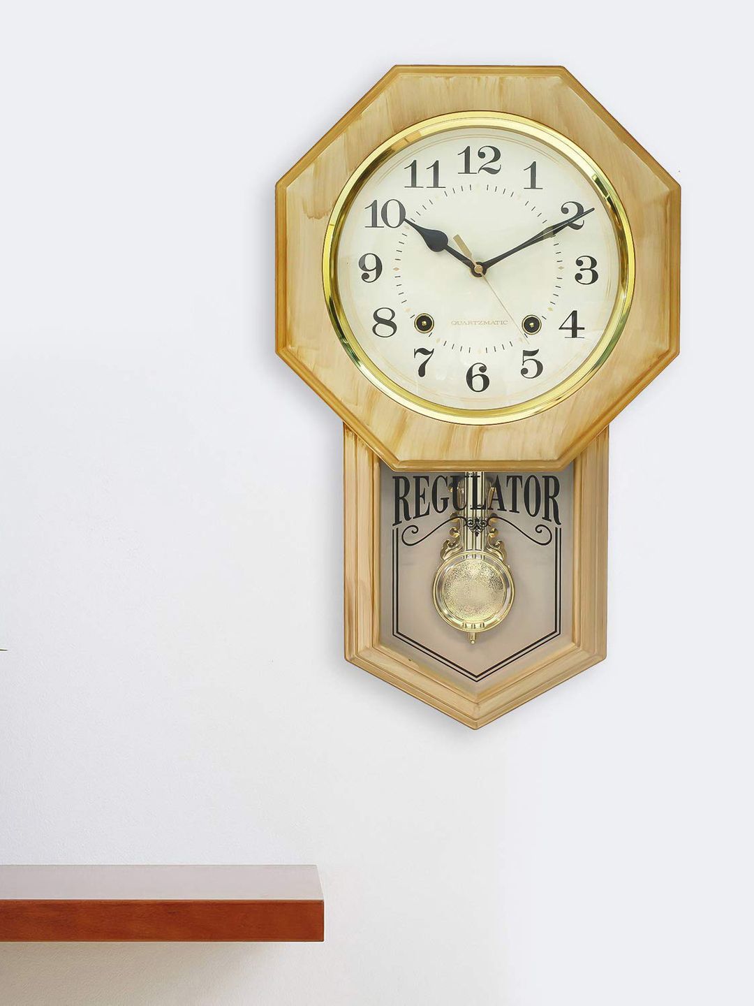 eCraftIndia Gold-Toned Geometric Solid Analogue Wall Clock 27cm x 45cm Price in India
