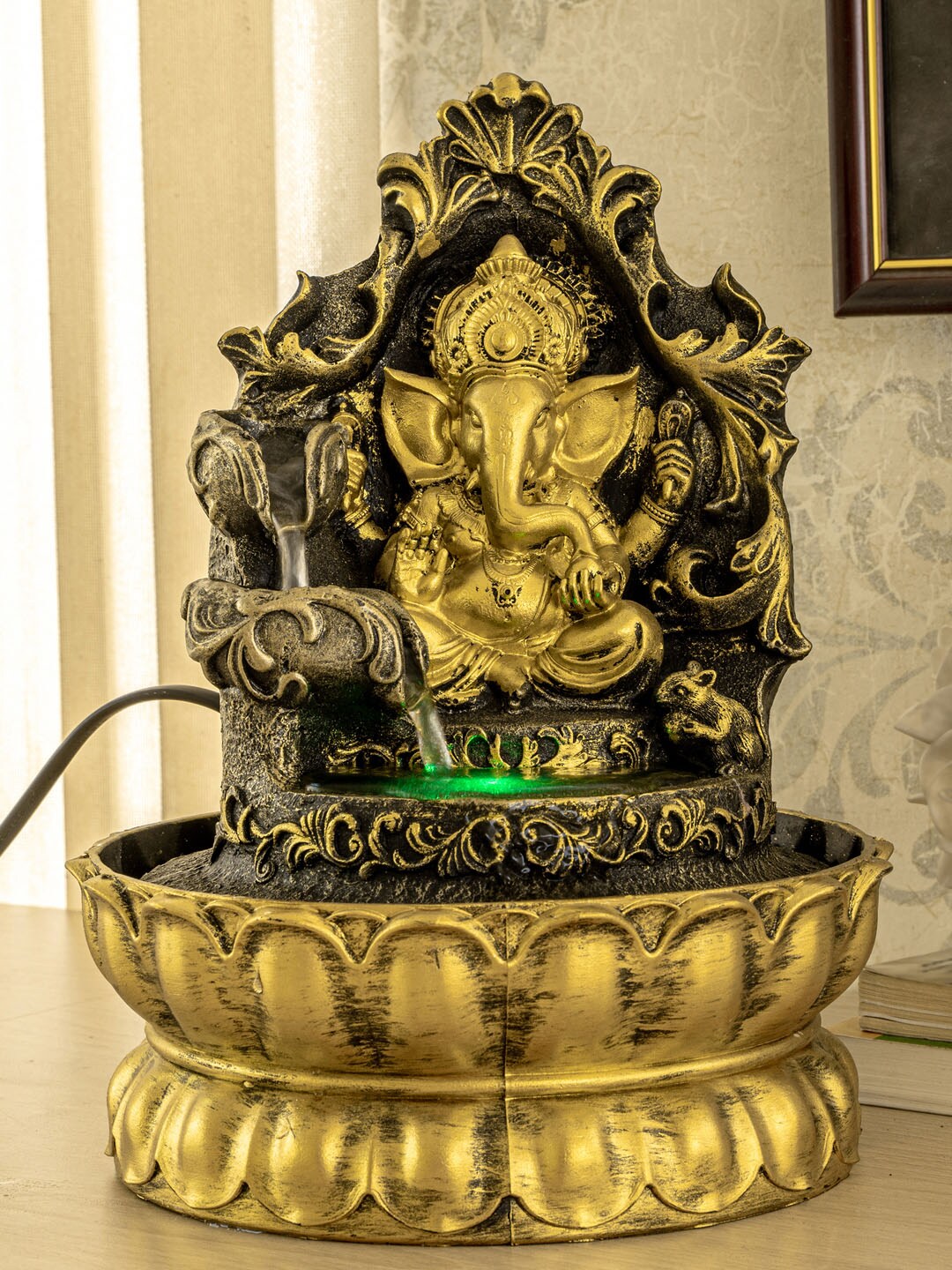 TIED RIBBONS Black & Gold-Toned Power Operated Welcome Home Ganesha LED Water Fountain Price in India