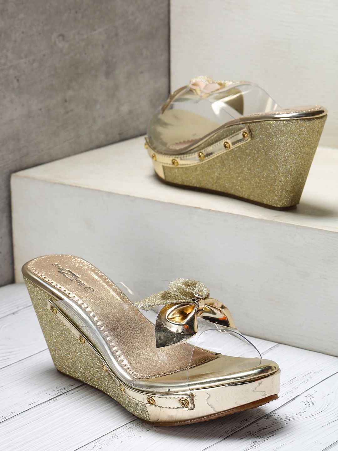 Shezone Women Transparent & Gold-Toned Bow Detail Heels Price in India