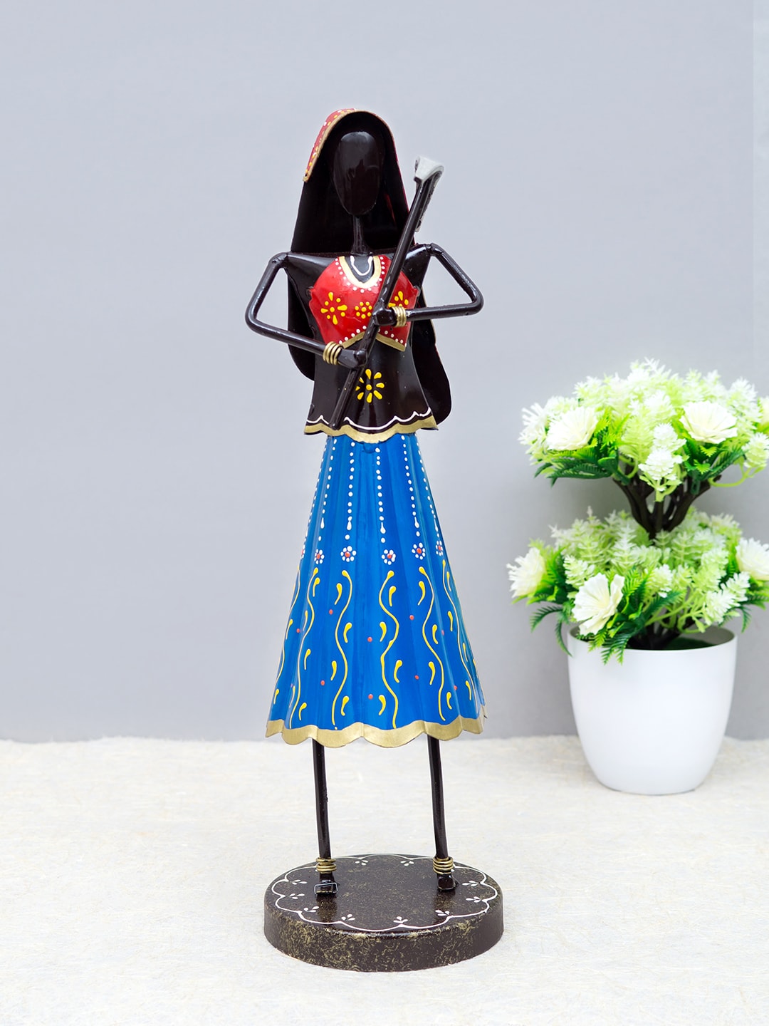 Golden Peacock Blue & Black Handcrafted Lady Farmer Showpiece Price in India