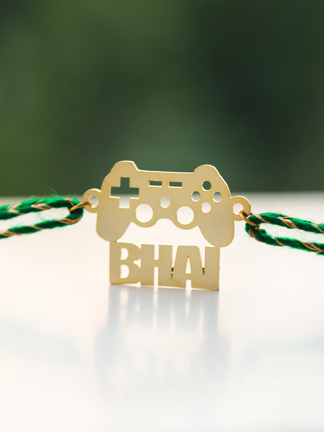Bigsmall Gold-Toned Bhai Emblazoned Handcrafted Rakhi Price in India