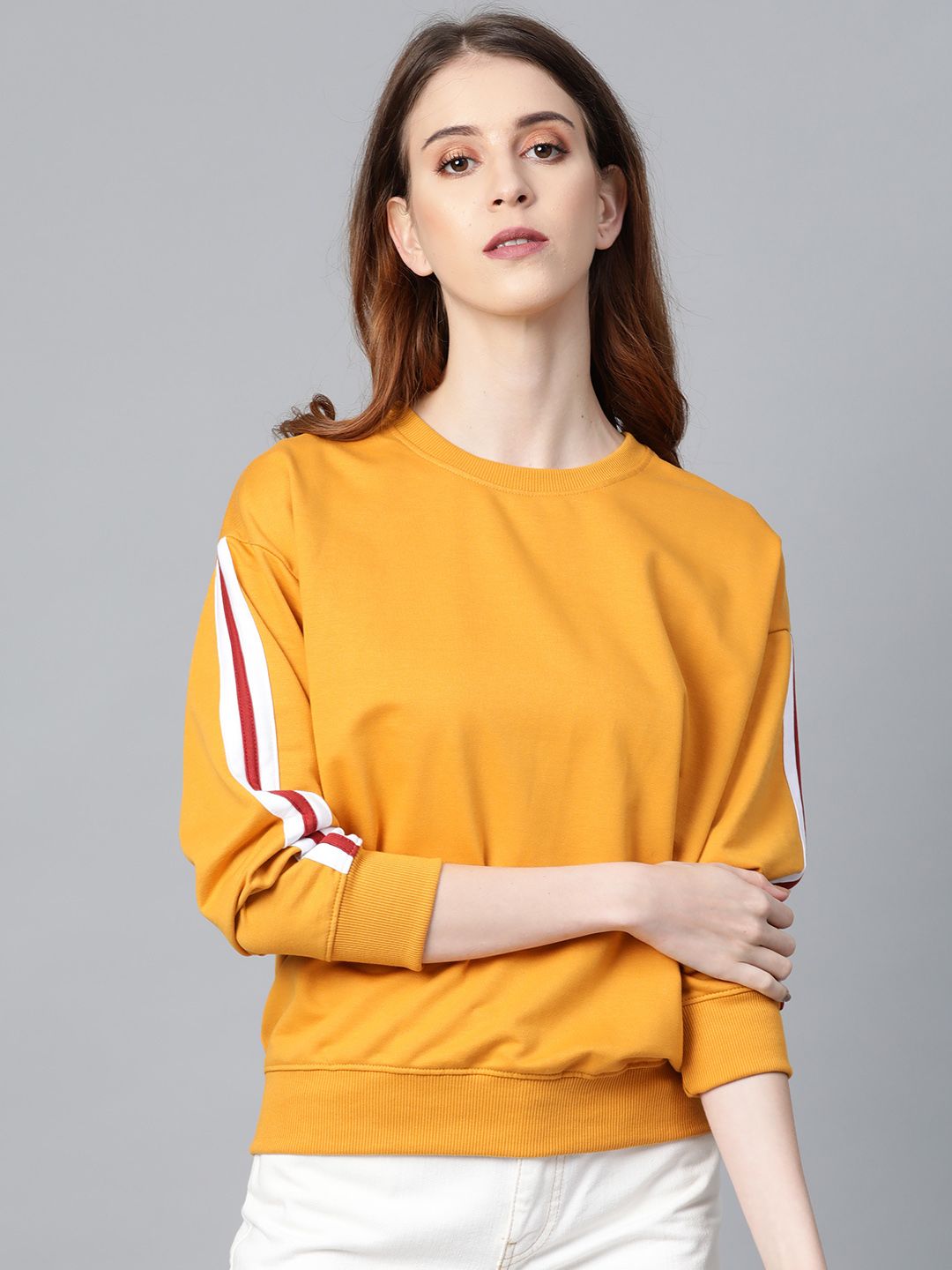 Roadster Women Mustard Yellow Solid Sweatshirt with Side Stripe Detail Price in India