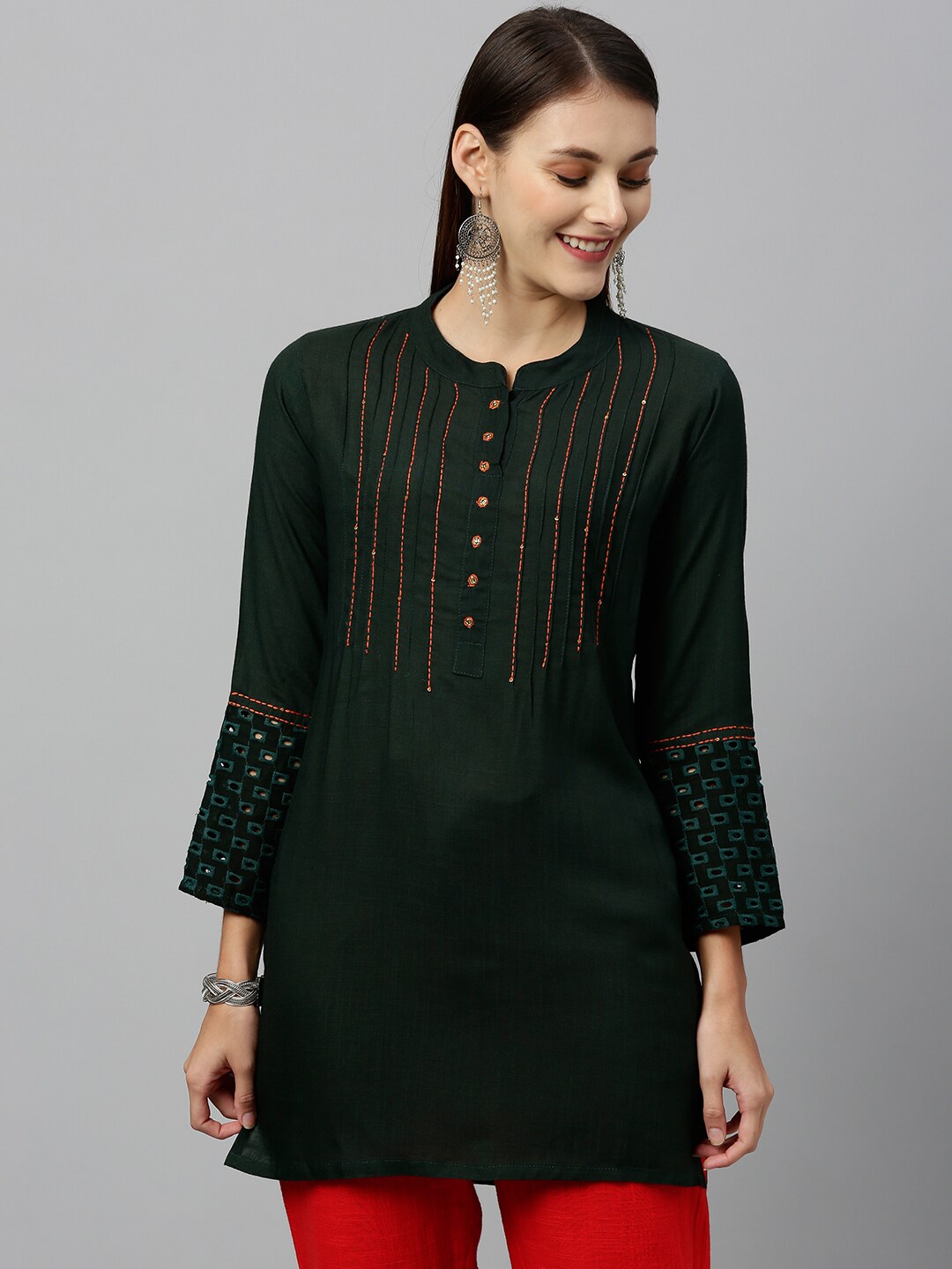 kipek Women Green Solid Front Tuck Tunic with Schiffli Detailing Price in India