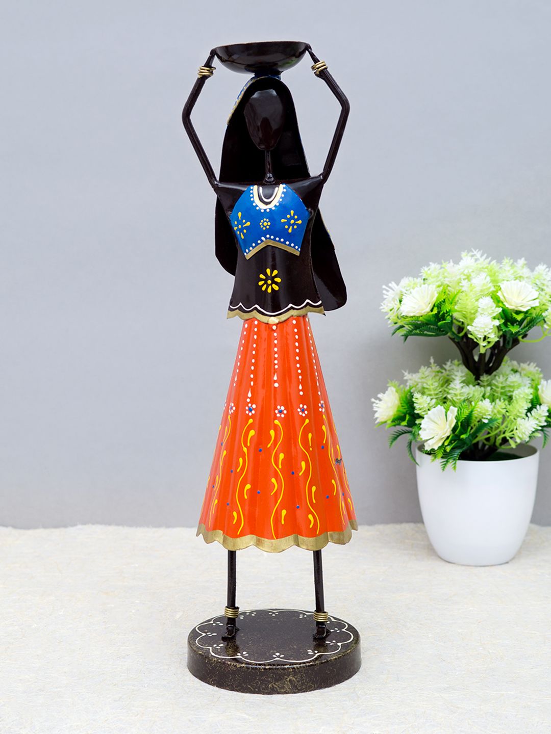 Golden Peacock Black & Orange Handcrafted Village Working Farmer lady Decorative Showpiece Price in India
