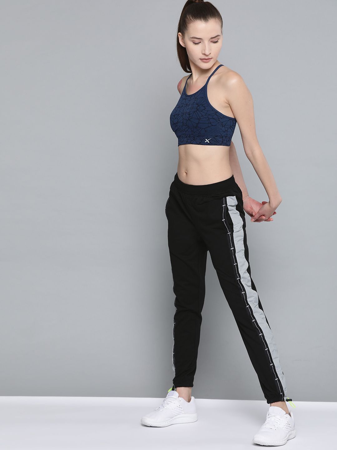 HRX by Hrithik Roshan Women Black Solid Slim Jogger Fit Bio-Wash Lifestyle Track Pants Price in India