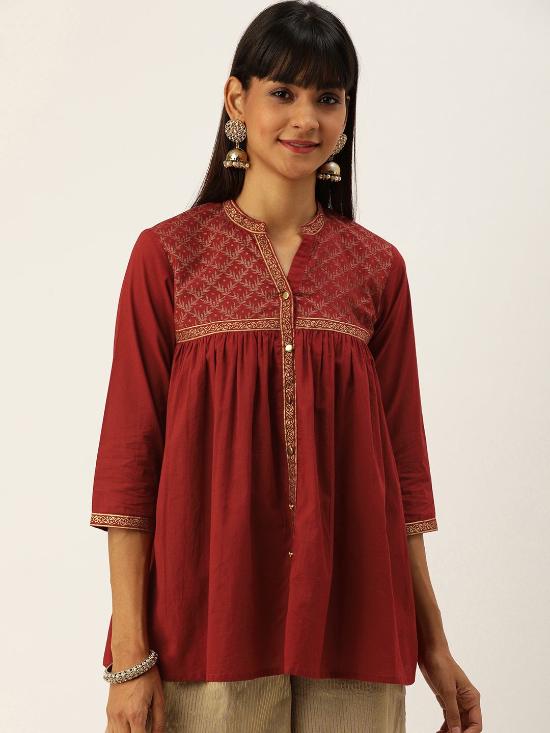 Varanga Women Maroon and Golden Printed Tunic with Gathered Detail Price in India