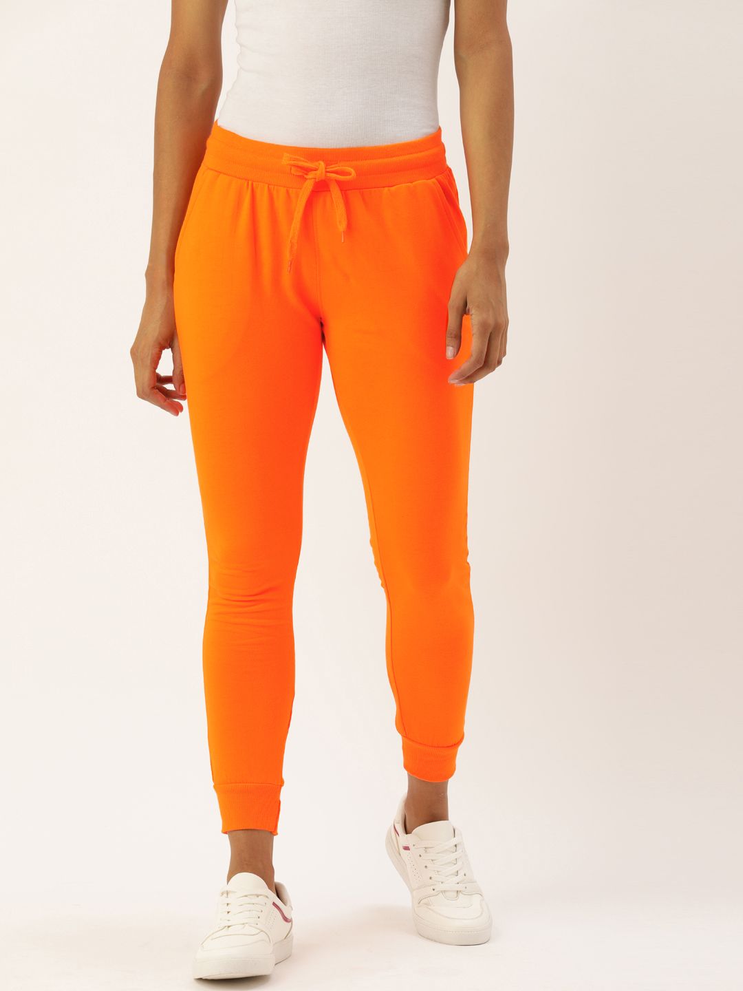Genius18 Women Orange Solid Slim Fit Joggers Price in India