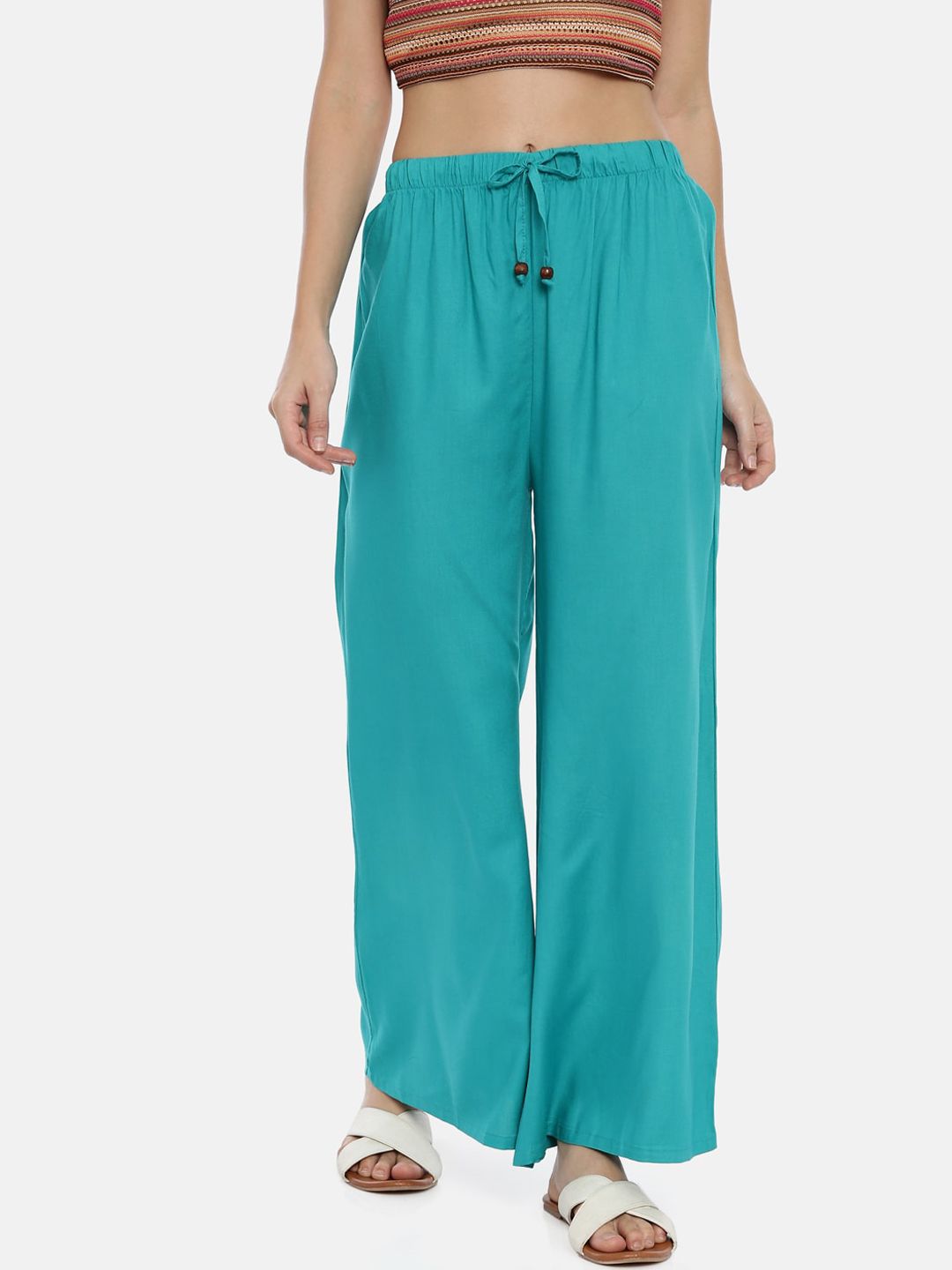GOLDSTROMS Women Teal Green Solid Flared Palazzos Price in India