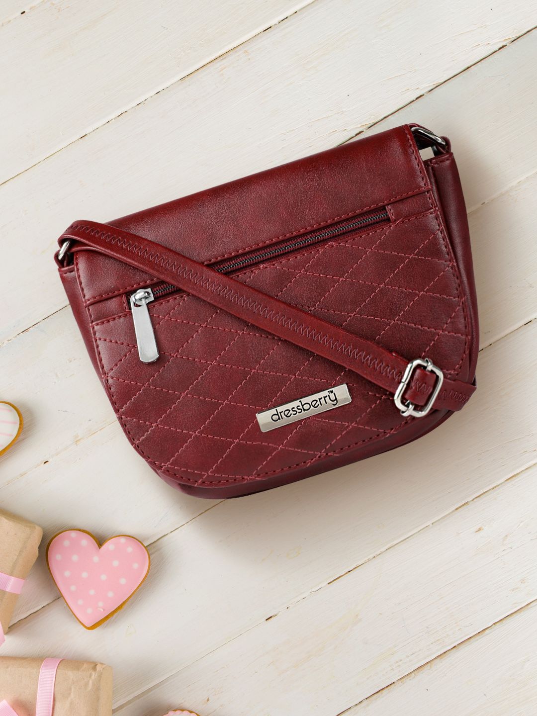 DressBerry Burgundy Textured Sling Bag Price in India