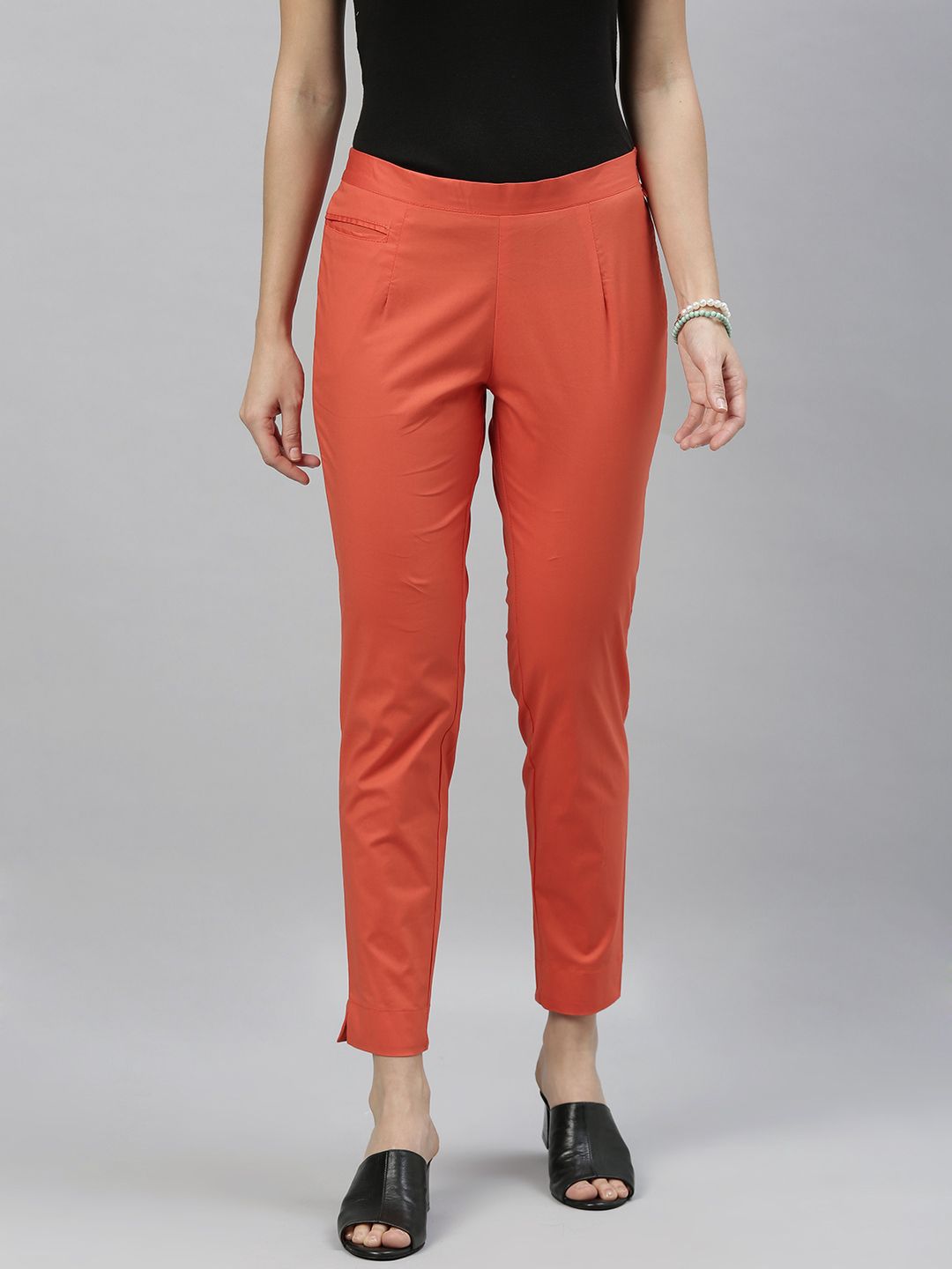 ETIQUETTE Women Rust Orange Slim Fit Solid Regular Trousers Price in India