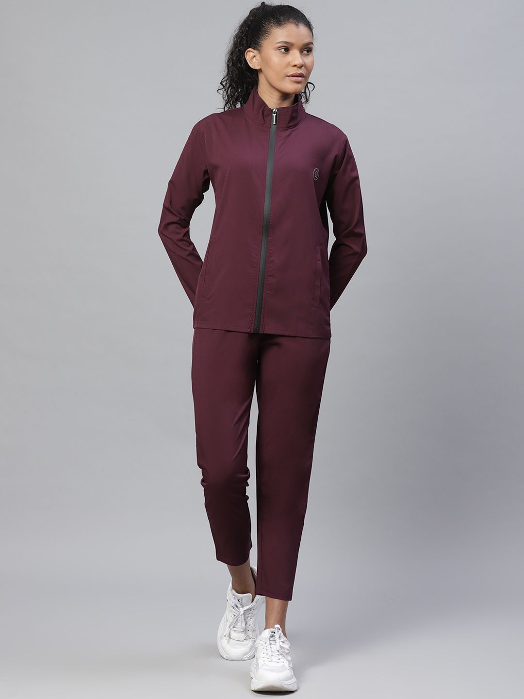 Chkokko Women Burgundy Solid Tracksuit Price in India