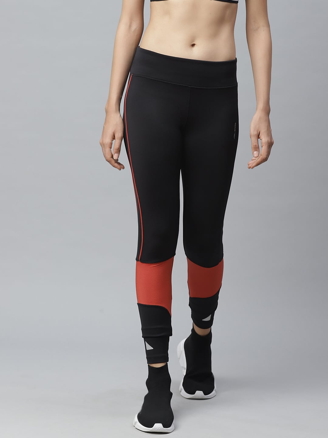 Alcis Women Black & Rust Orange Colourblocked Fitted Cropped Running Tights Price in India