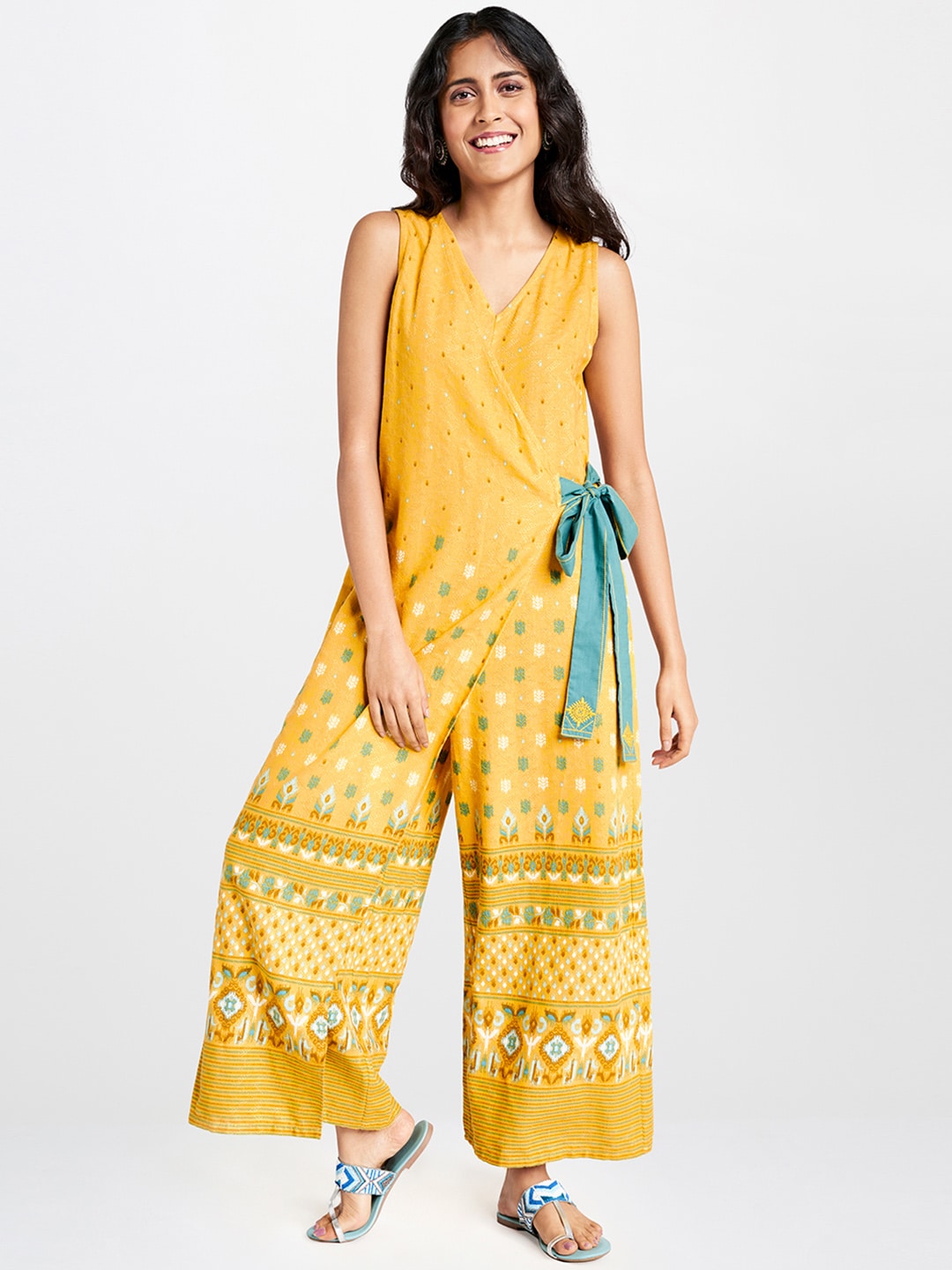 Global Desi Women Mustard Yellow & Green Printed Wrap Basic Jumpsuit with Waist Tie-Ups Price in India